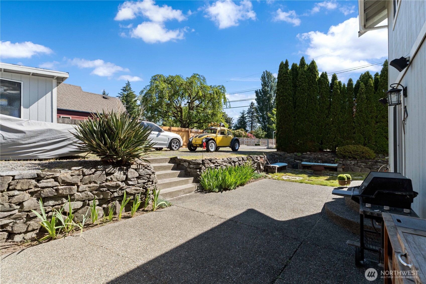 Large back patio with stairs to the shed and tons of parking.