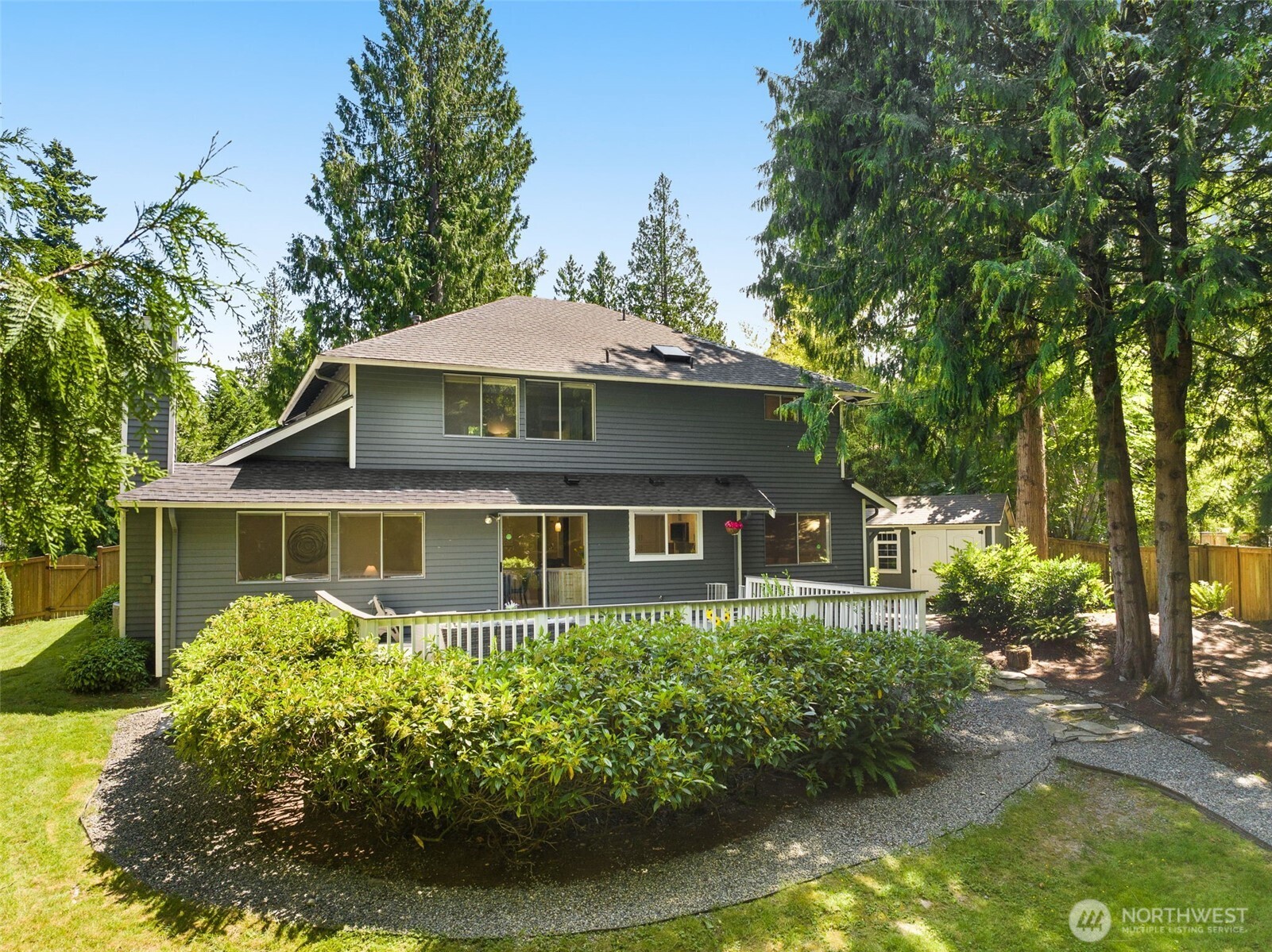 The perfect place to play & entertain- fully fenced, beautifully landscaped 1/4 acre lot dream yard!