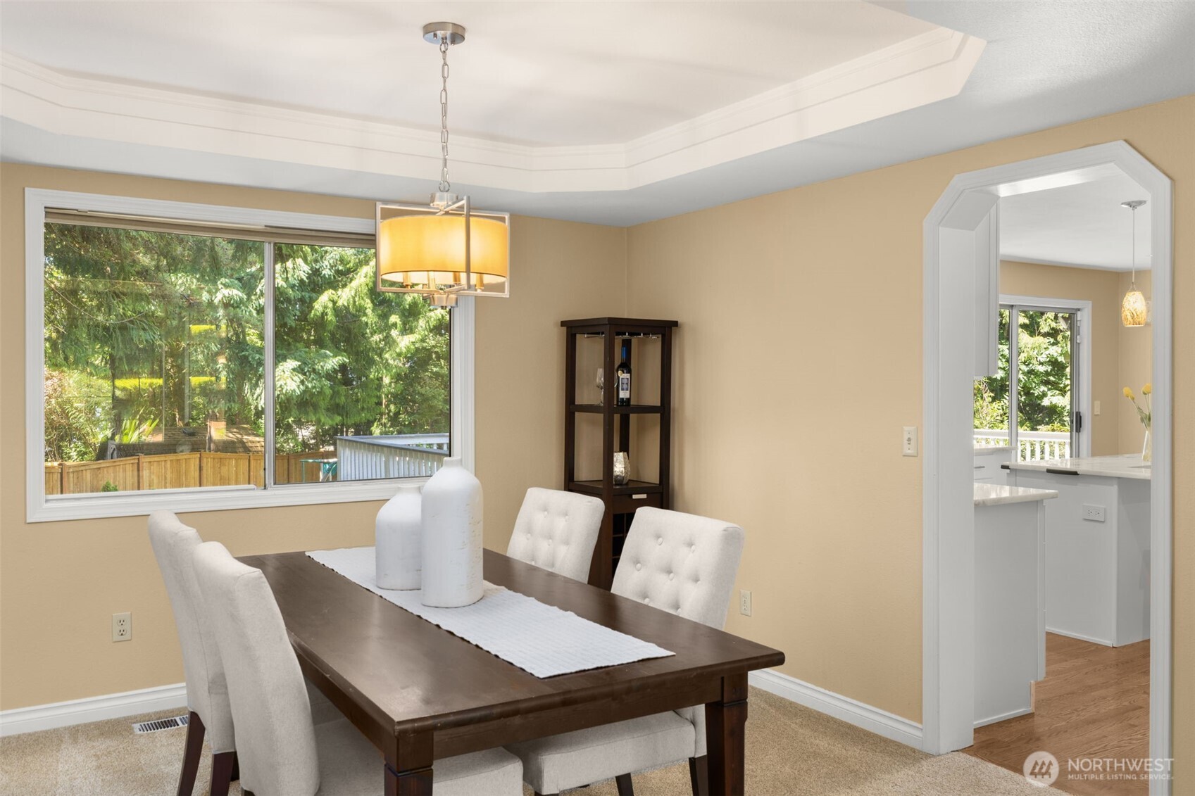 Another view of the dining room leading into the kitchen.
