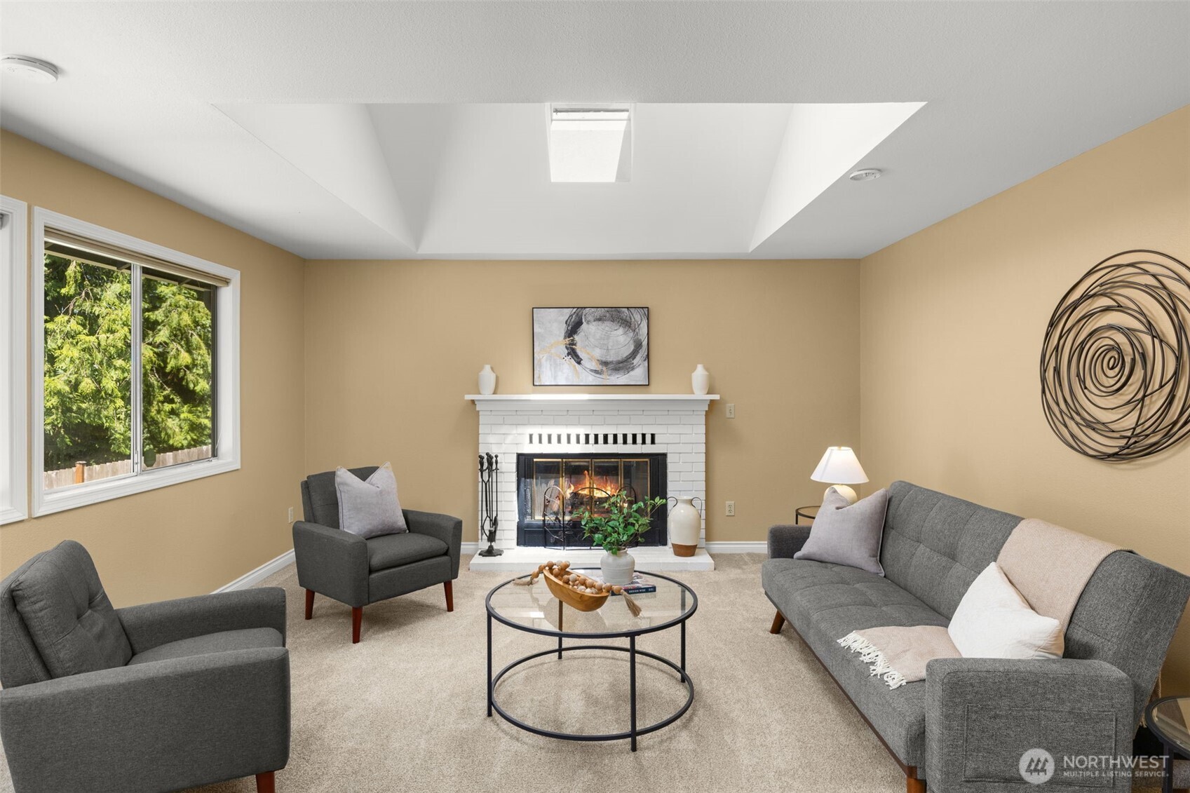 Family room with cozy fireplace & plenty of natural light.