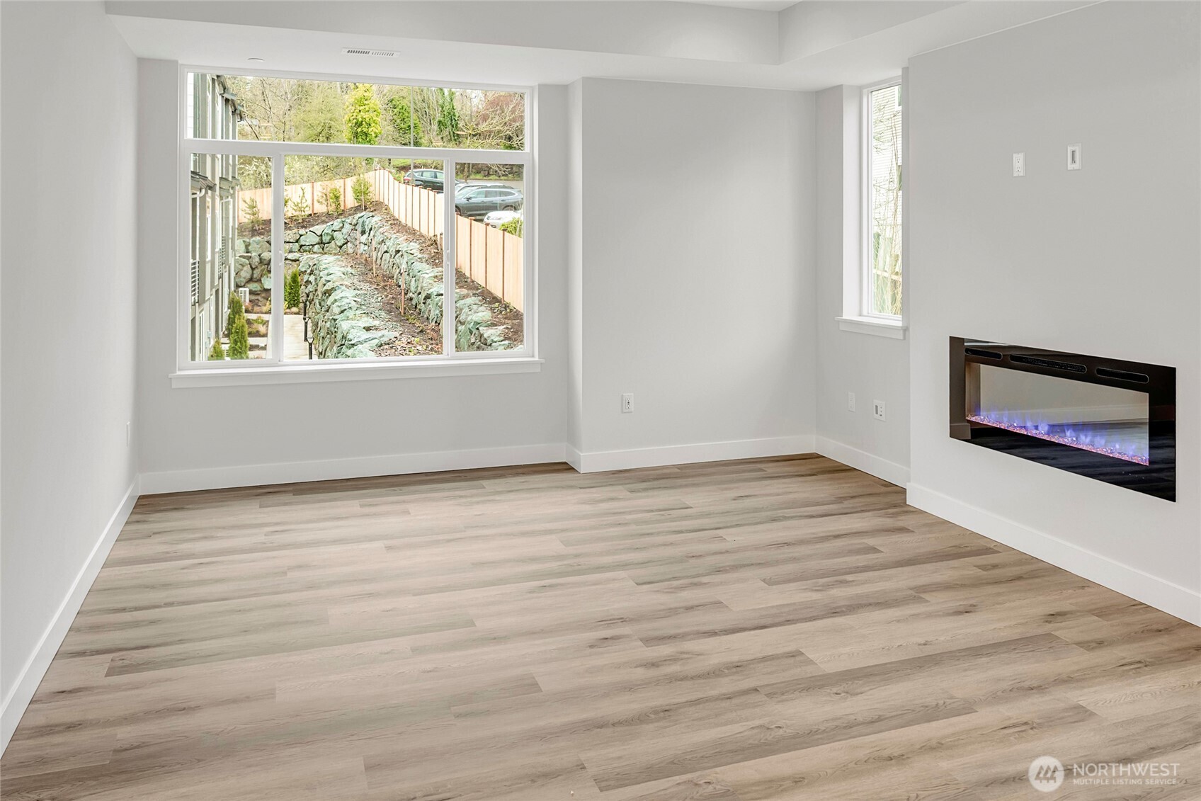 Bright and airy living space, with LVP flooring