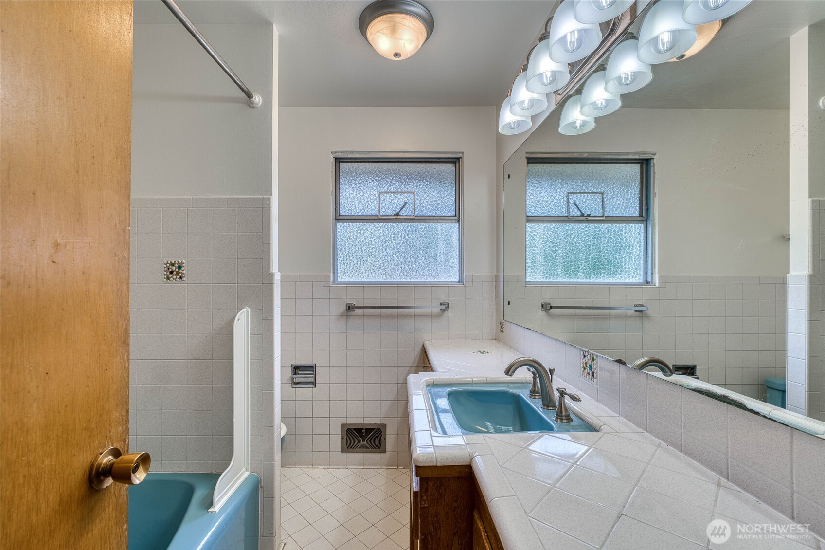 This gives a GREAT picture of ALL of the stunning and extensive tile work that this bathroom offers