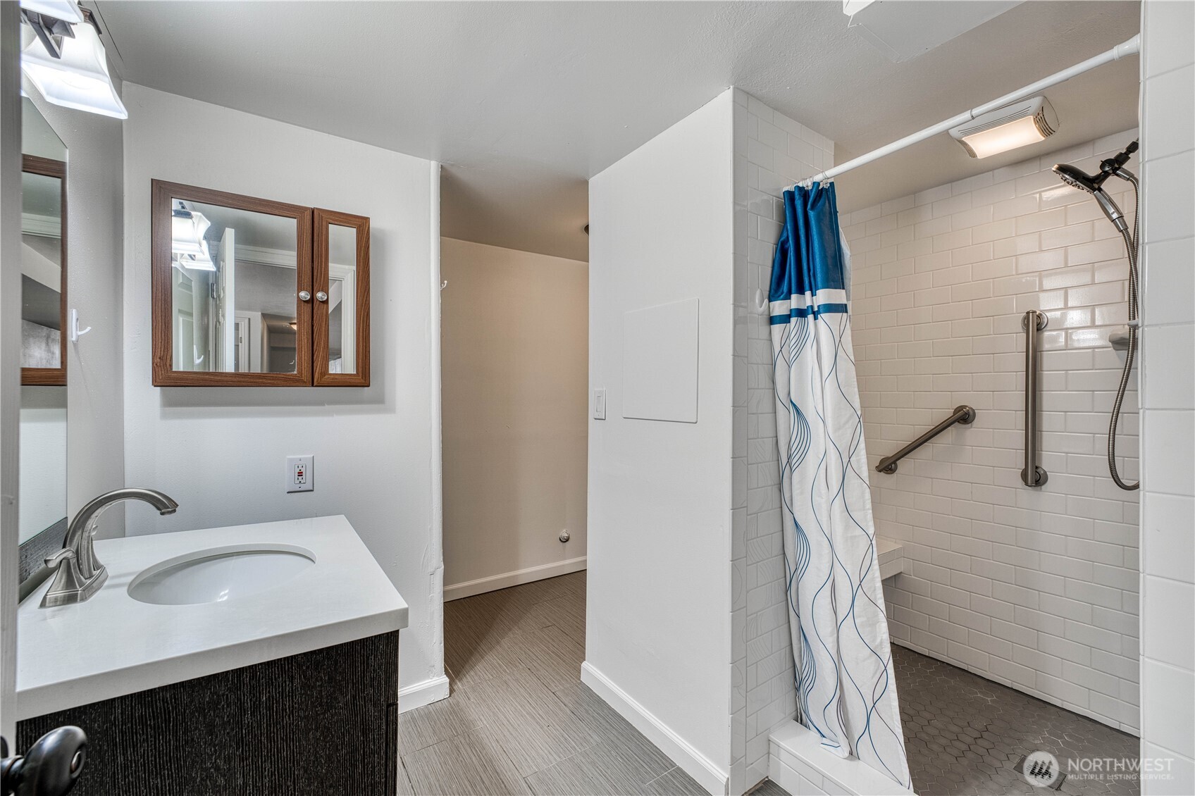 This is a beautifully tiled, spacious 3/4 bath located on the lower level of the home. Check out the beautiful tile work on the floor and in the shower, STUNNING in person