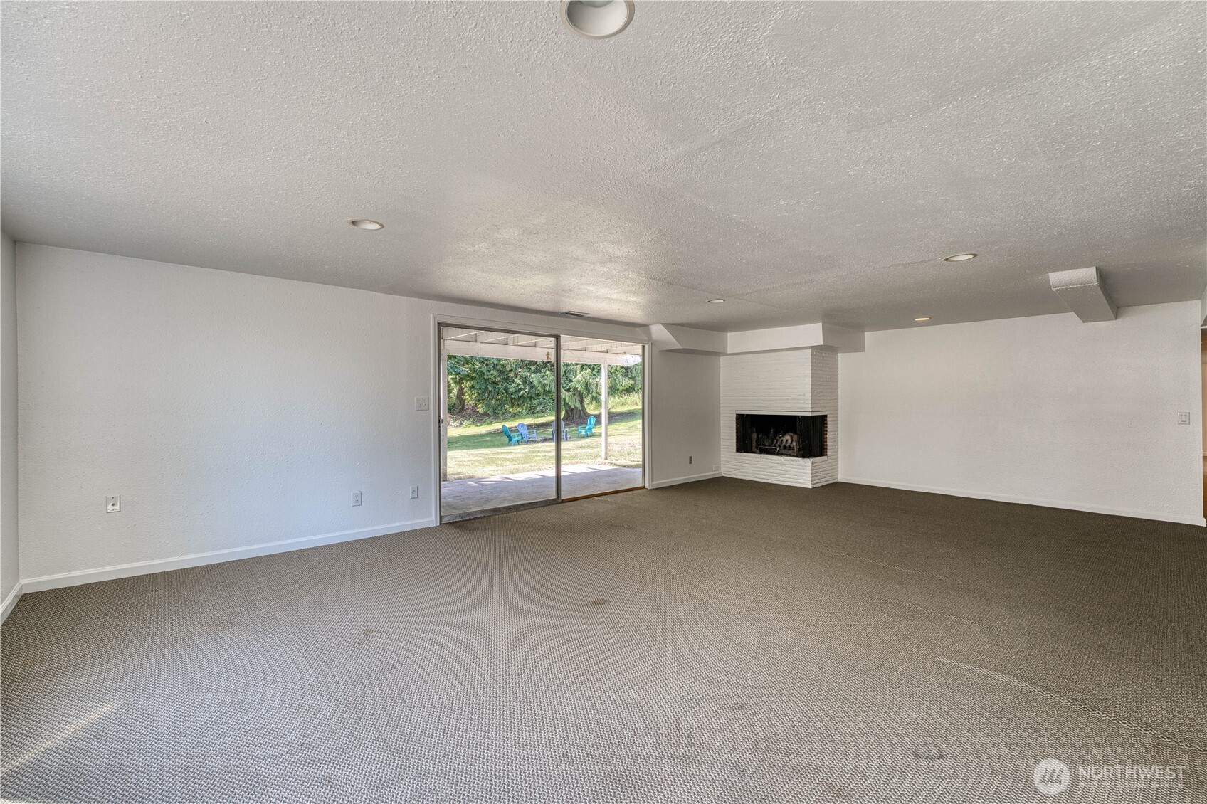 Another view of the HUGE family/livingroom space in the lower level of this spacious home