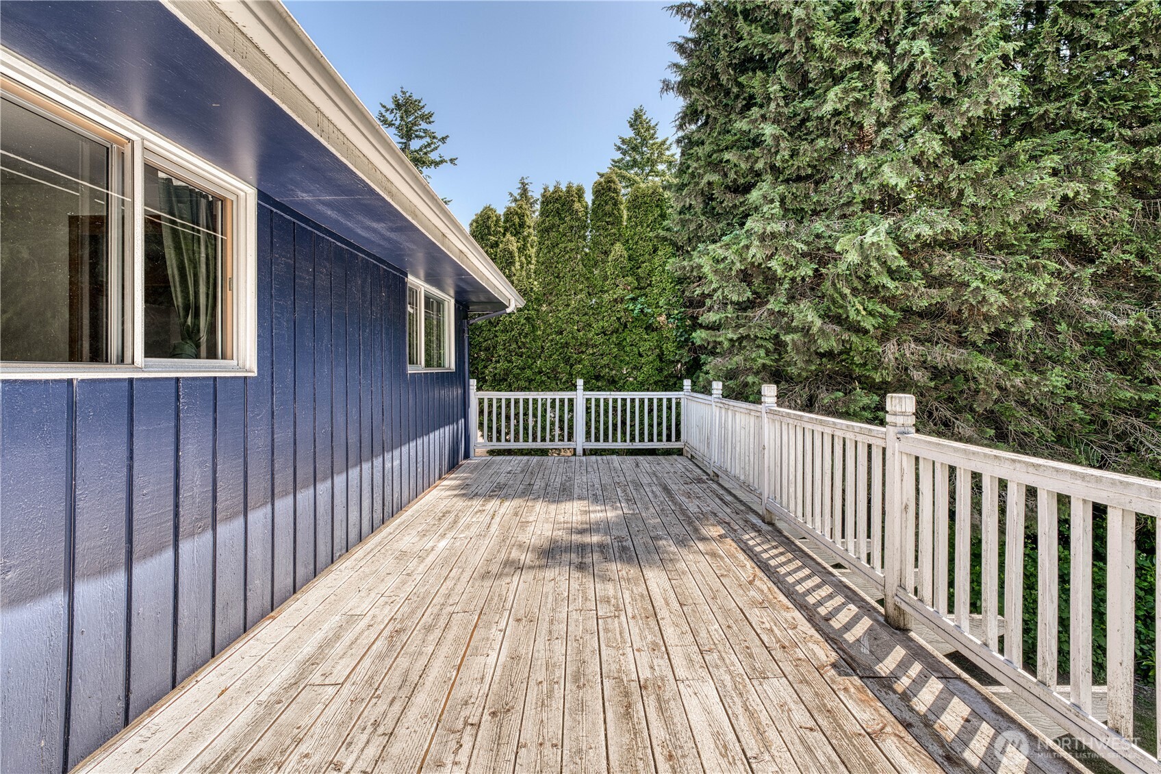 View of the upper level deck. From here you overlook your own .91 acre, parklike setting
