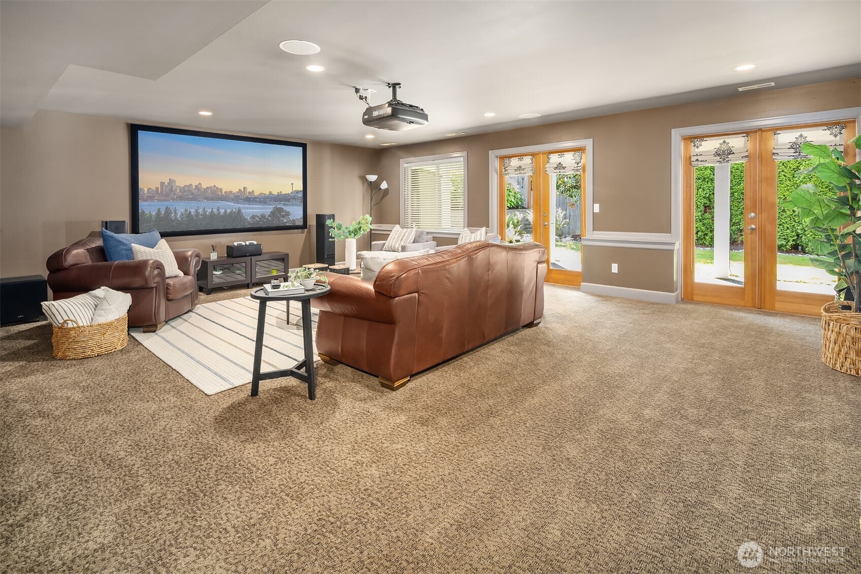 Dark basements can be uncomfortable spaces. Surely not the case here. The twin French doors serve a dual function of inviting in the natural light and providing easy access to the private back yard.