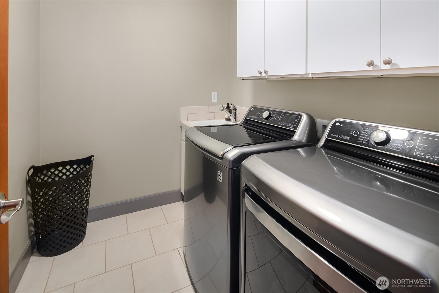 Laundry rooms are a bit of a lost art in today's construction. Not the case here! This space is conveniently located upstairs. All kinds of storage and room to operate! You will appreciate the sweet utility sink.