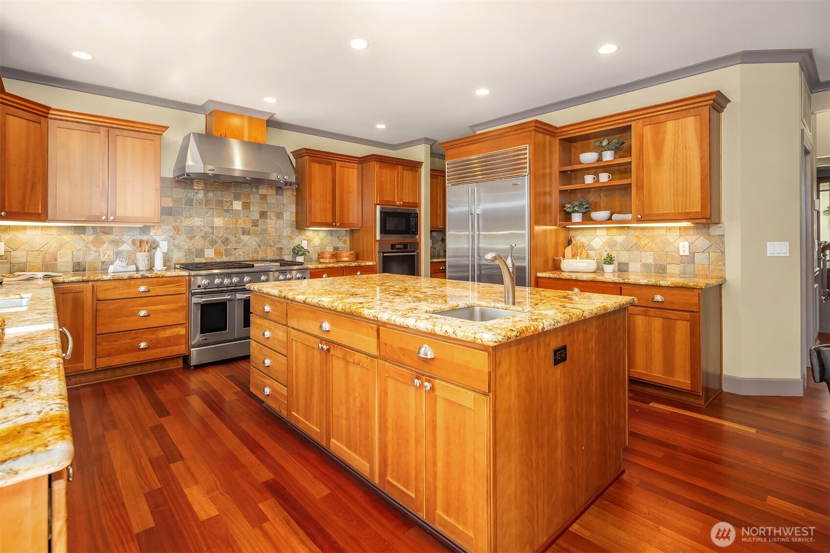 The kitchen is the heart of any home and this one is fabulous! The oversized island provides the perfect centerpiece. You will love that it is not obstructed with a cook top making nearly all of its area useable.