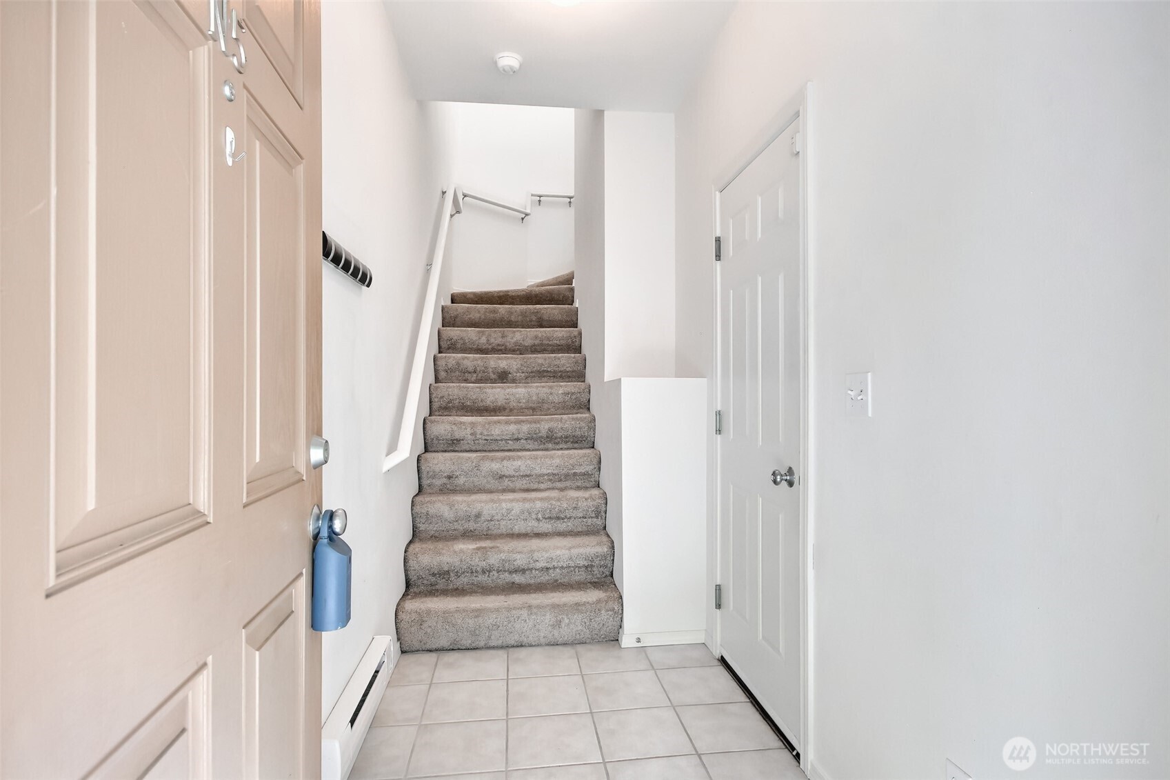 No one lives above you or below you. Shared common wall is your hallway.