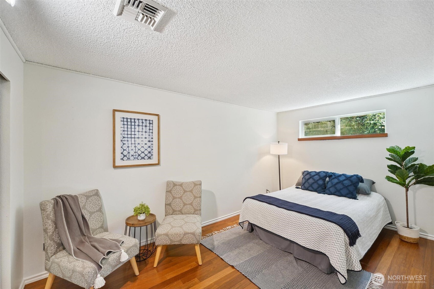 The bedroom on the main floor is delightful