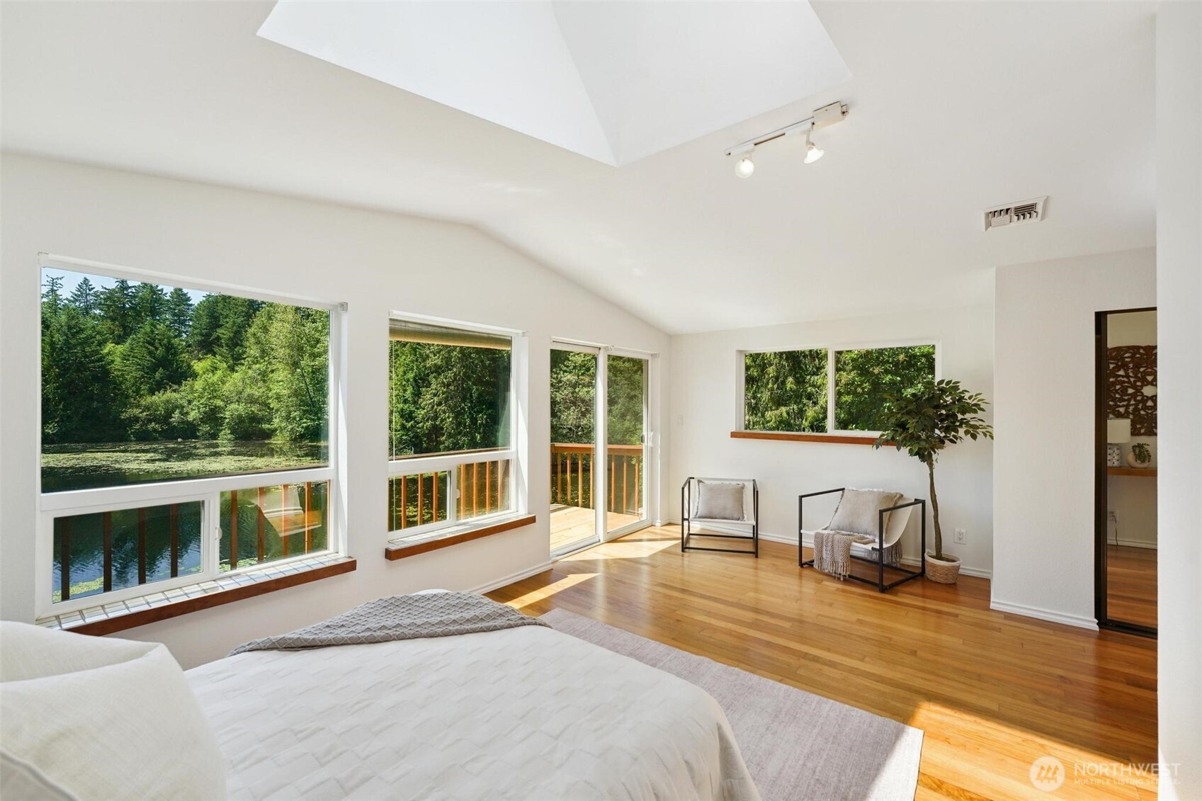 Relax in bed or enjoy coffee and stretching on your private deck with a view