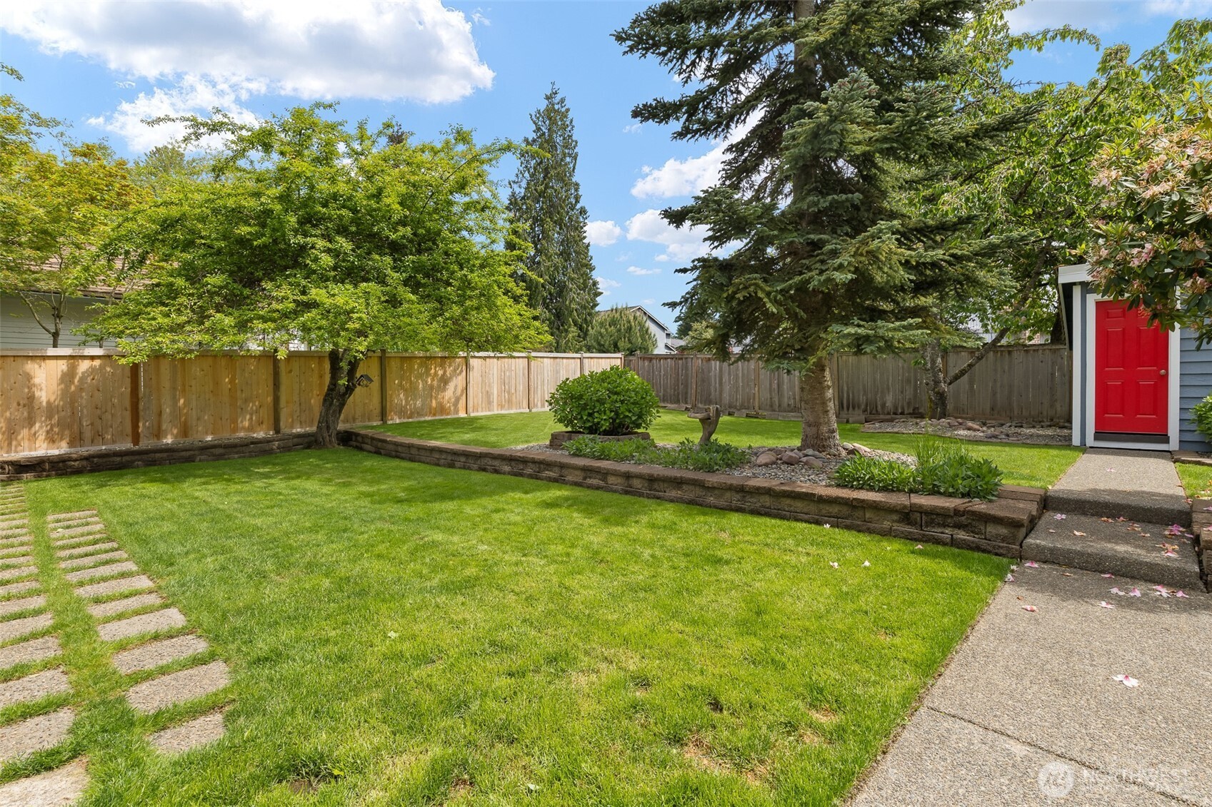 Level lot offers perfect play and garden space.