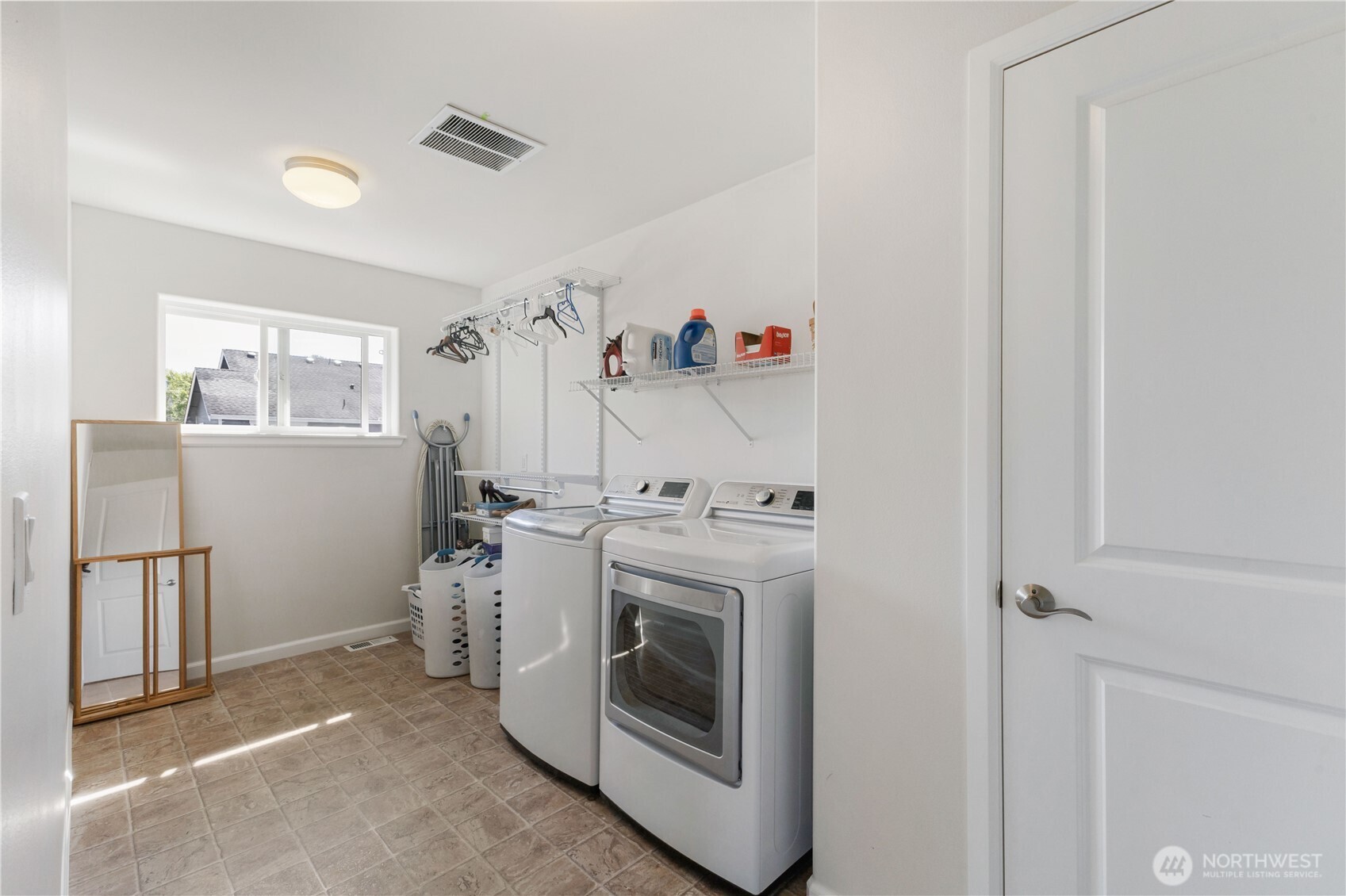 The upstairs utility room features a large linen closet, extra shelving, plumbed for a utility sink and ability to have more than one dryer!