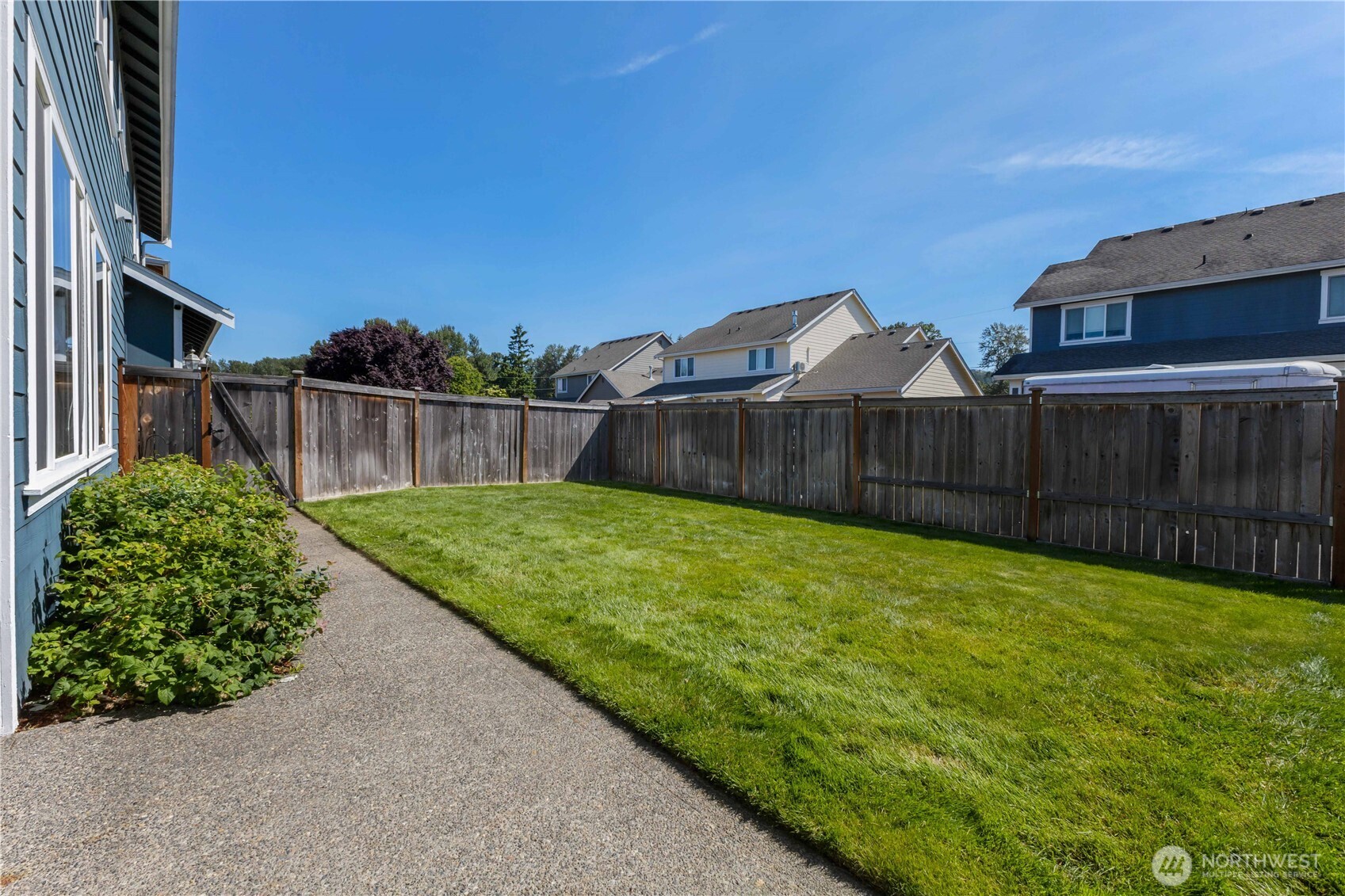 Fenced and landscaped backyard complete with compost garden.