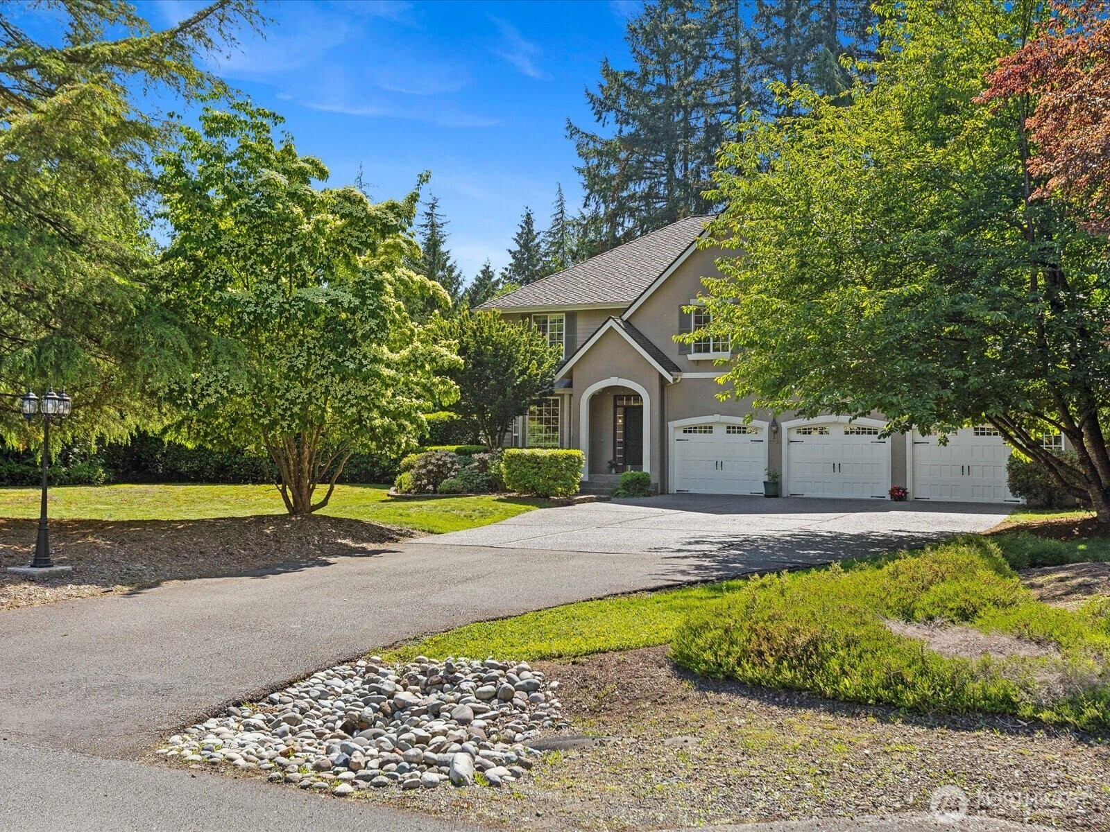 Long drive way for plenty of parking plus a 3 car garage
