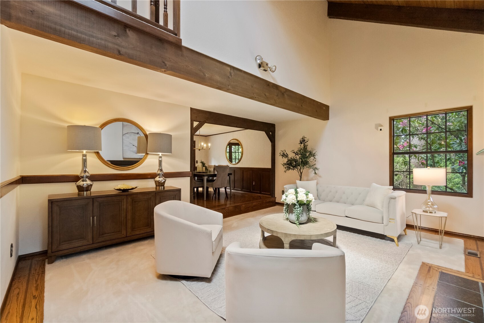 The soaring ceilings in the formal living room are warm and welcoming and flooded with light.