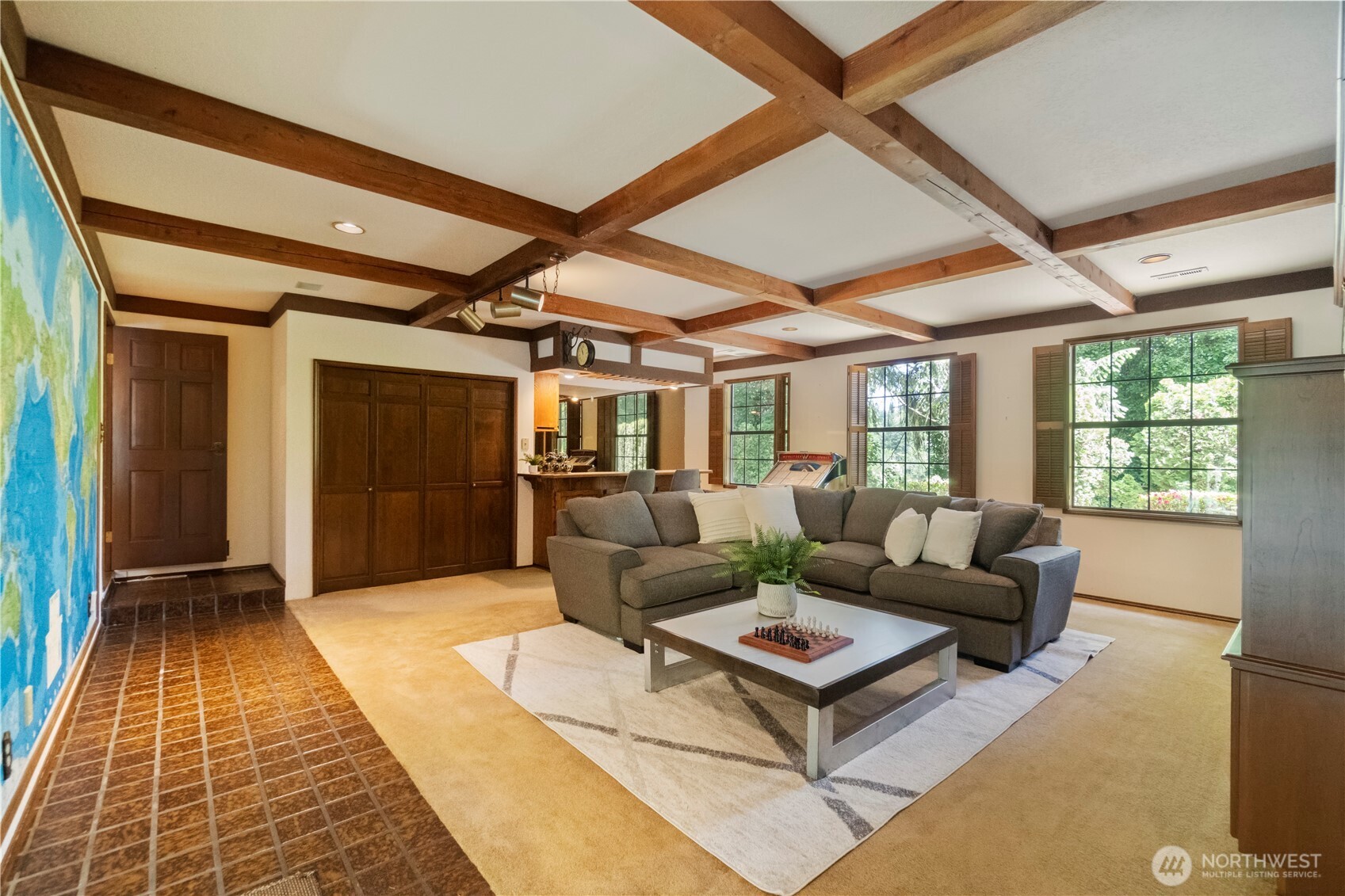 This is a picture of the bonus room in the south wing of the home taken from the door to the breezeway and garage.