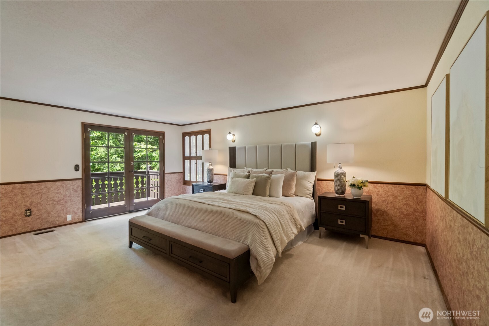 Abundant Primary SUITE w/ French Doors and balcony overlooking the beautiful deck and backyard.