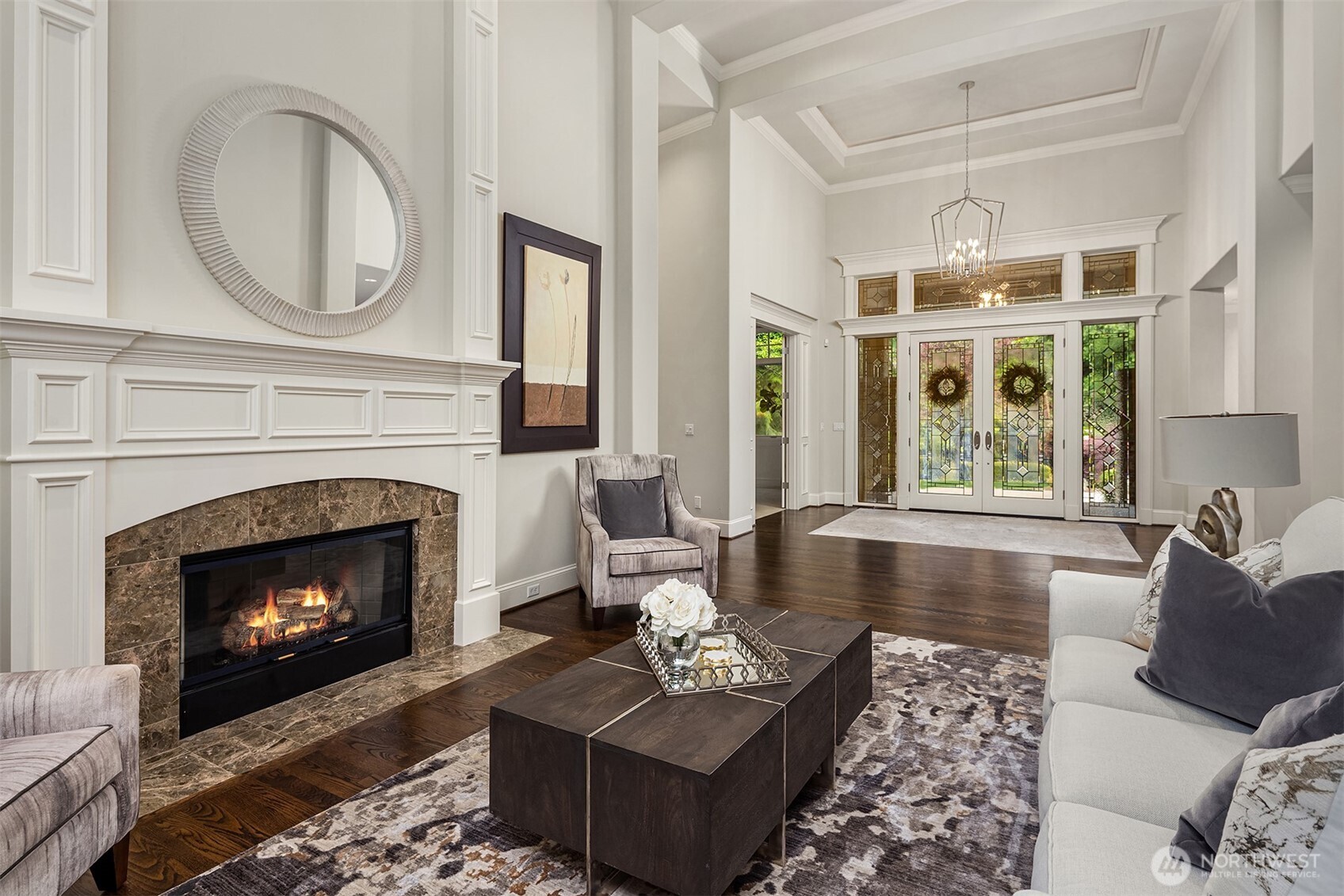 Den with high ceiling, double doors, custom built in bookcase, is light filled and ideally situated by the front door and primary bedroom on the main floor. Second home office is in detached garage.