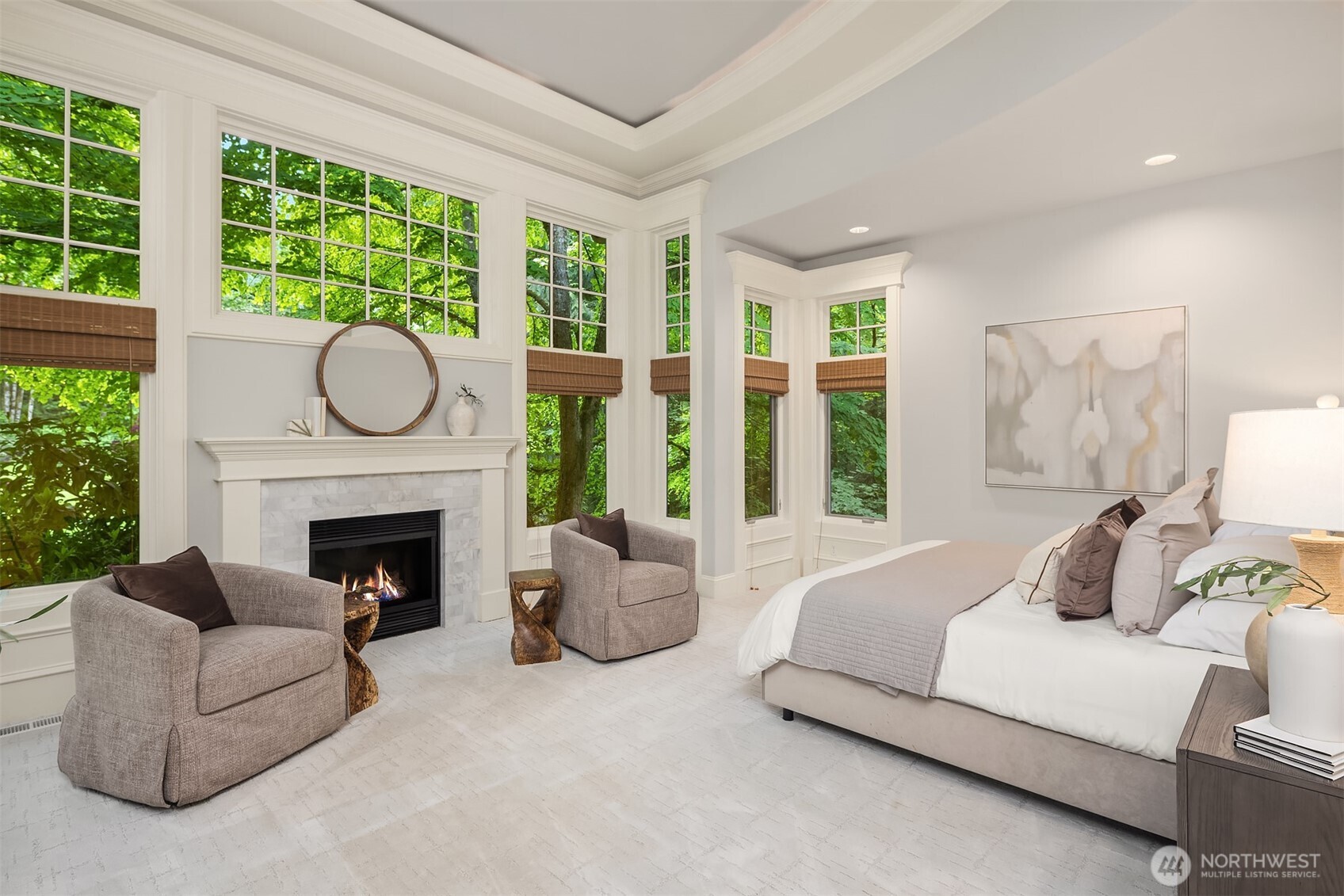 Primary bedroom with connection to adjoining bath flooded with natural light.