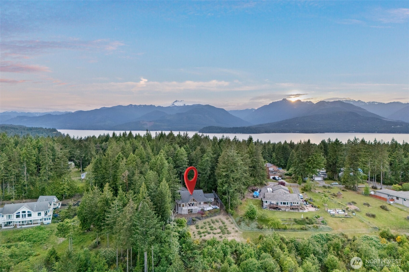 A view of the home from the east. Hood Canal and Olympics to the west. Seabeck Scenic beach state park and the Misery point boat launch are by.