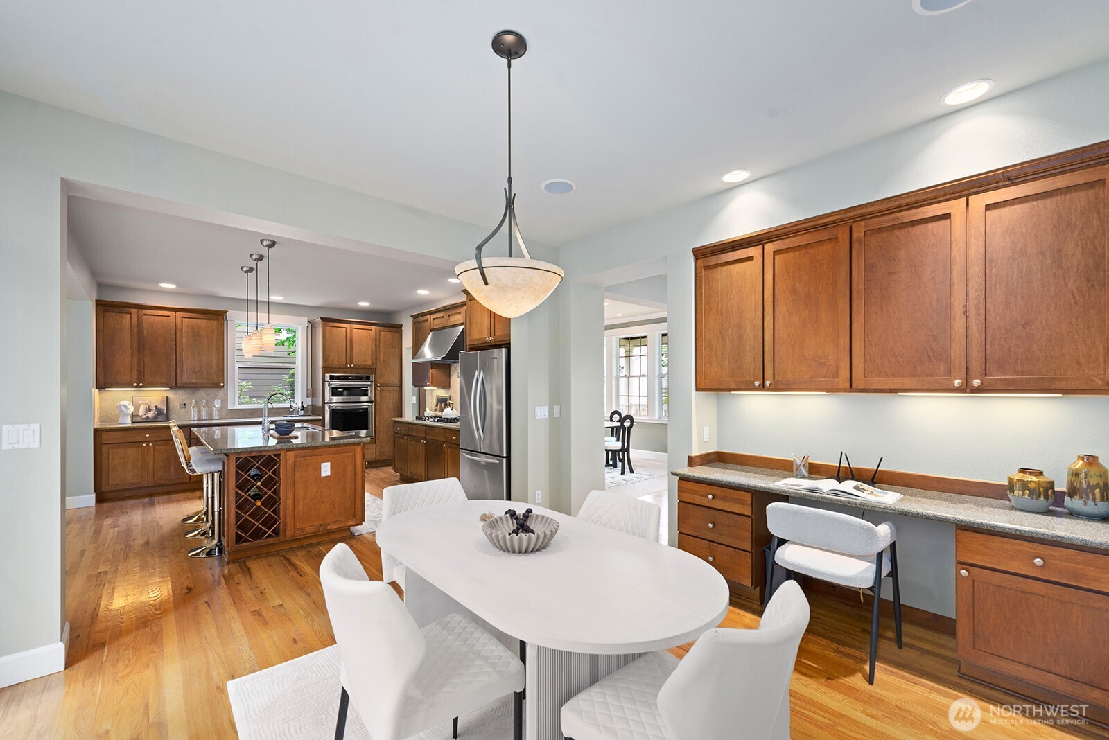 Eat-in area of the kitchen with additional office space.
