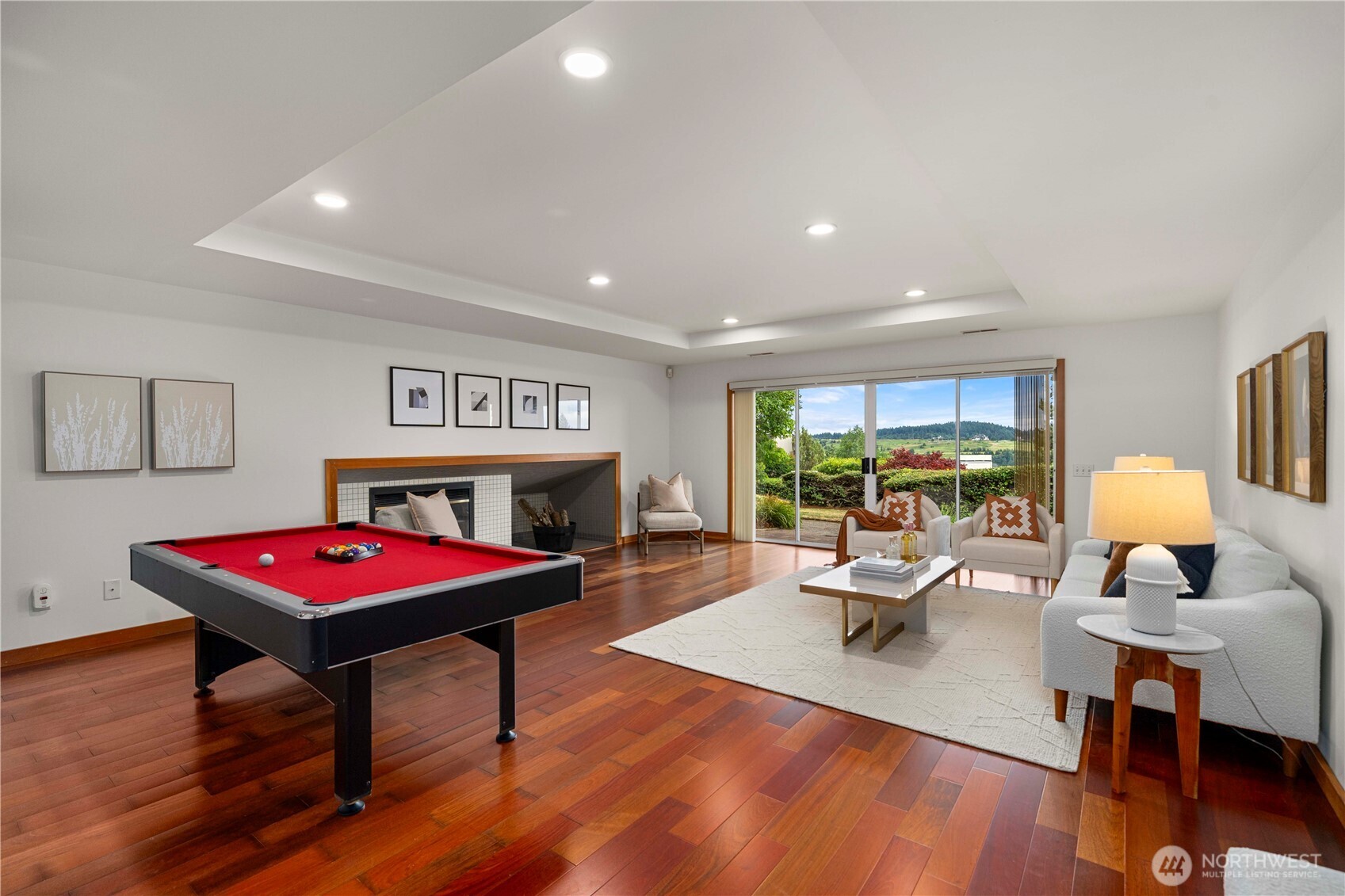 Light-filled bonus space with views of golf course and Mt Rainier, has a sliding doors to a patio—perfect for enjoying peaceful views and fresh air year-round.