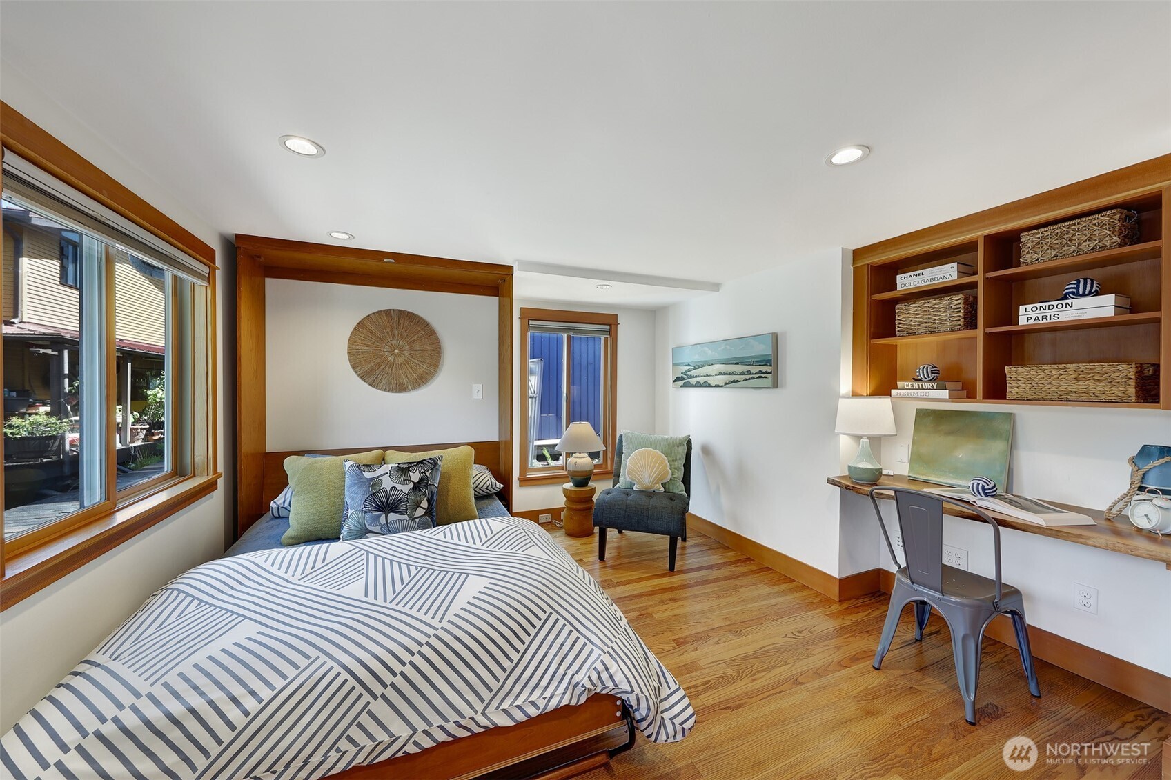 Back down to the main level, this is the second bedroom which can also be an office.  The murphy bed is convenient and there is a closet to the right of the live edge built in desk.