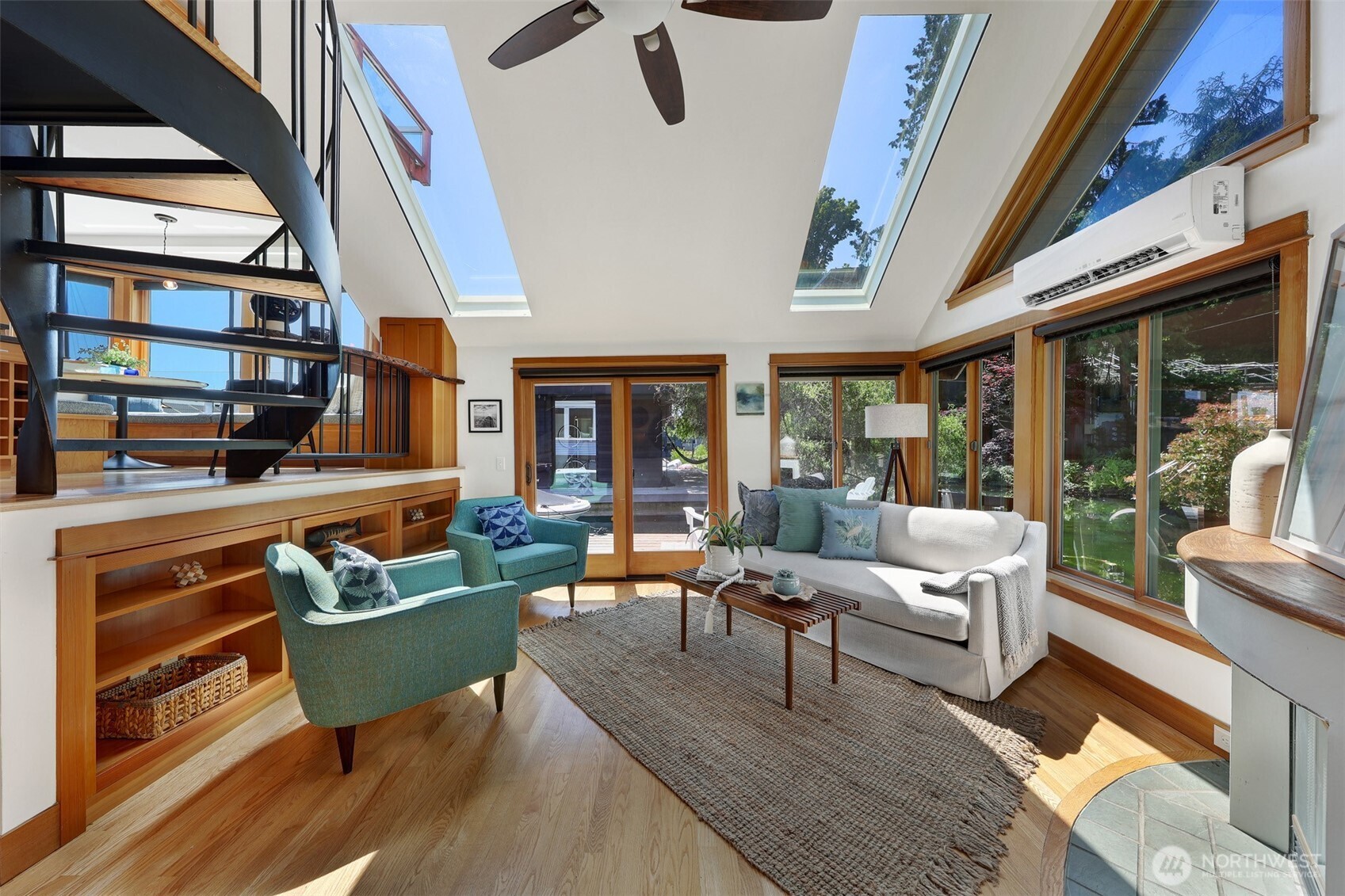 See those lovely bookshelves behind the green chairs?  It's a secret compartment for lots and lots of storage.