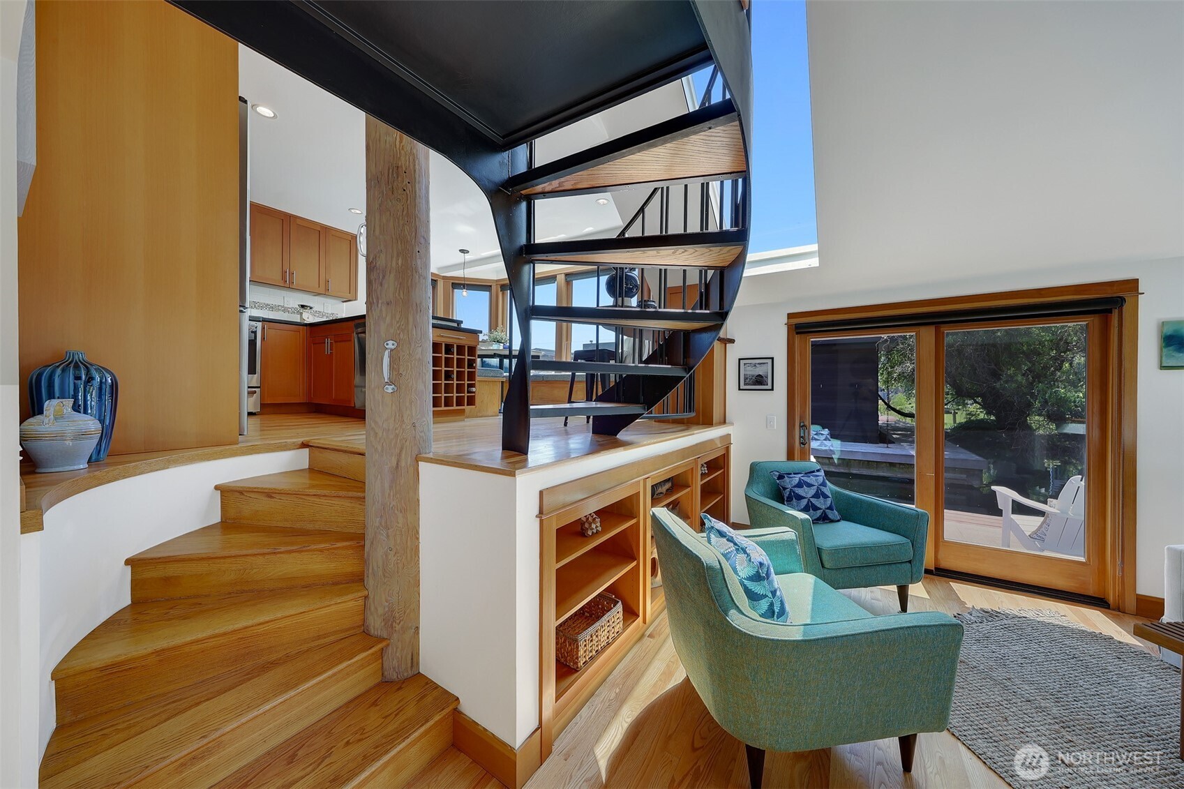 Just take a look at that beautifully crafted staircase with the oak hardwood floors transitioning into the dark iron to create definition and depth.