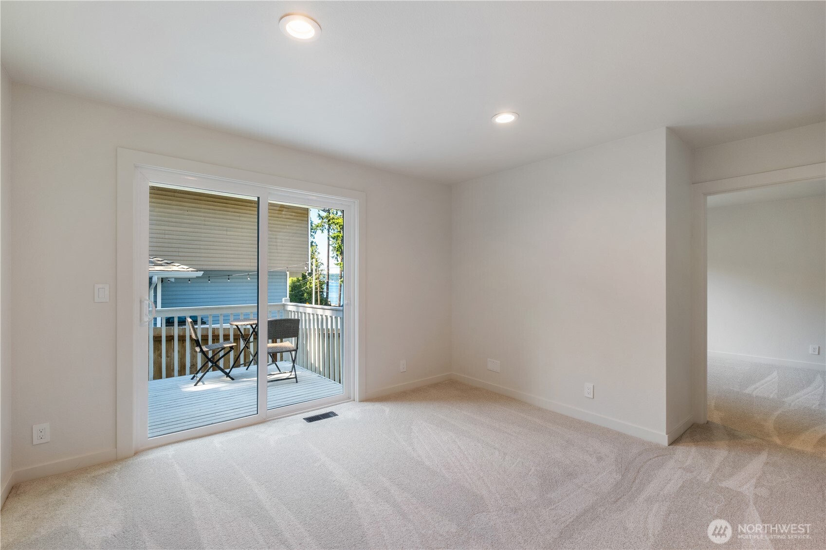 Bonus room with private deck, perfectly located between bedroom 2 & 3 on the lower level.