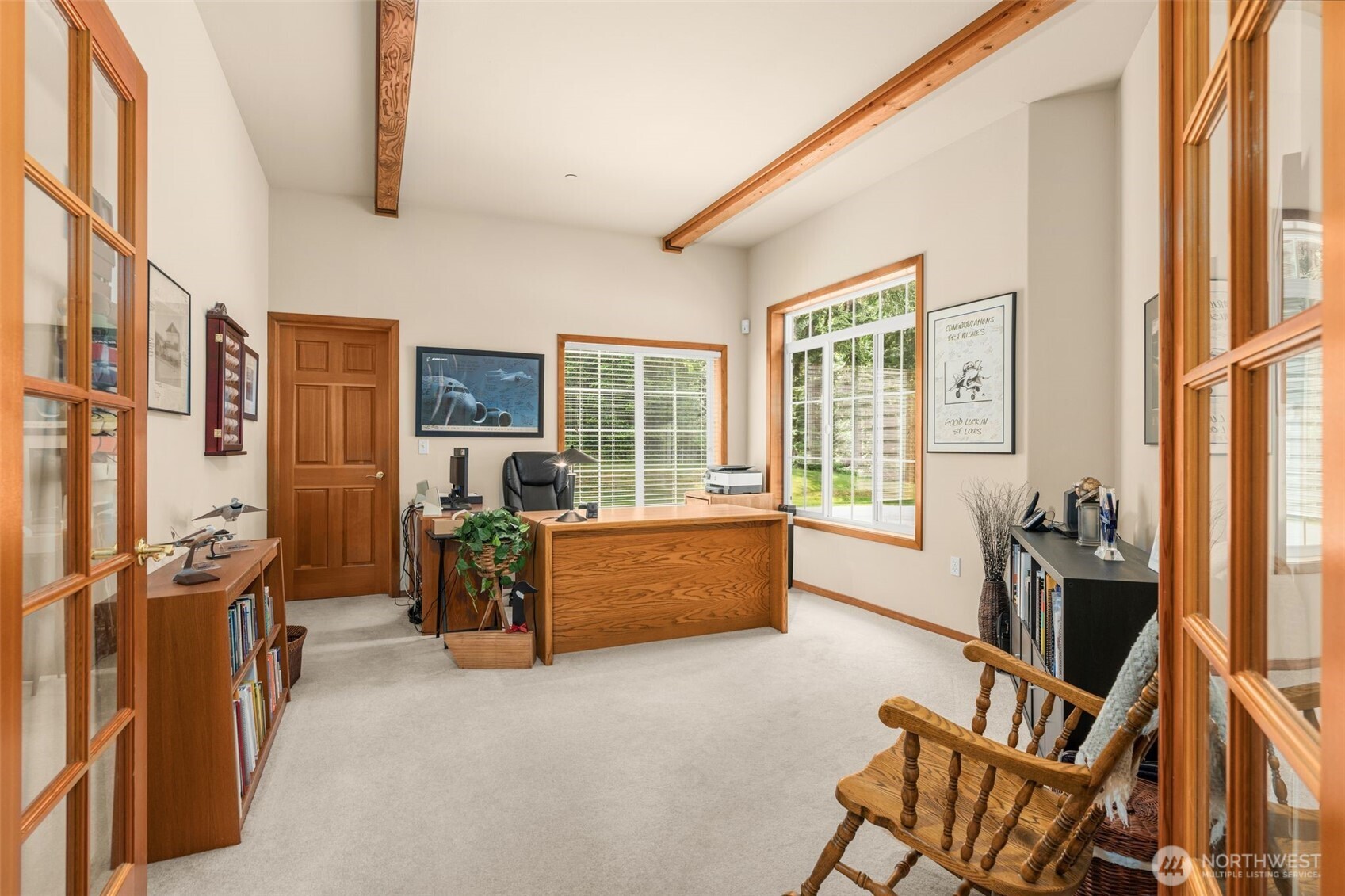 French doors and 2 oversized windows flood the main floor office with natural light. Walk-in storage area.