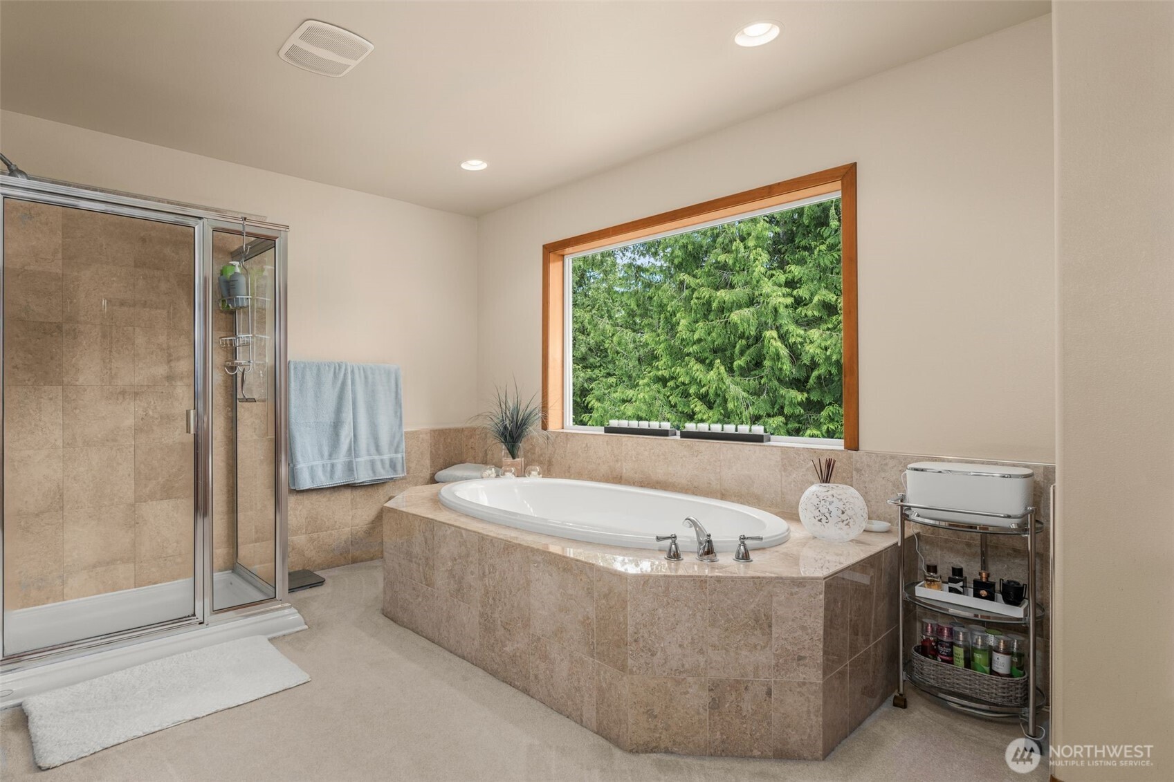 Soak up paradise from the expansive primary suite’s soaking tub.