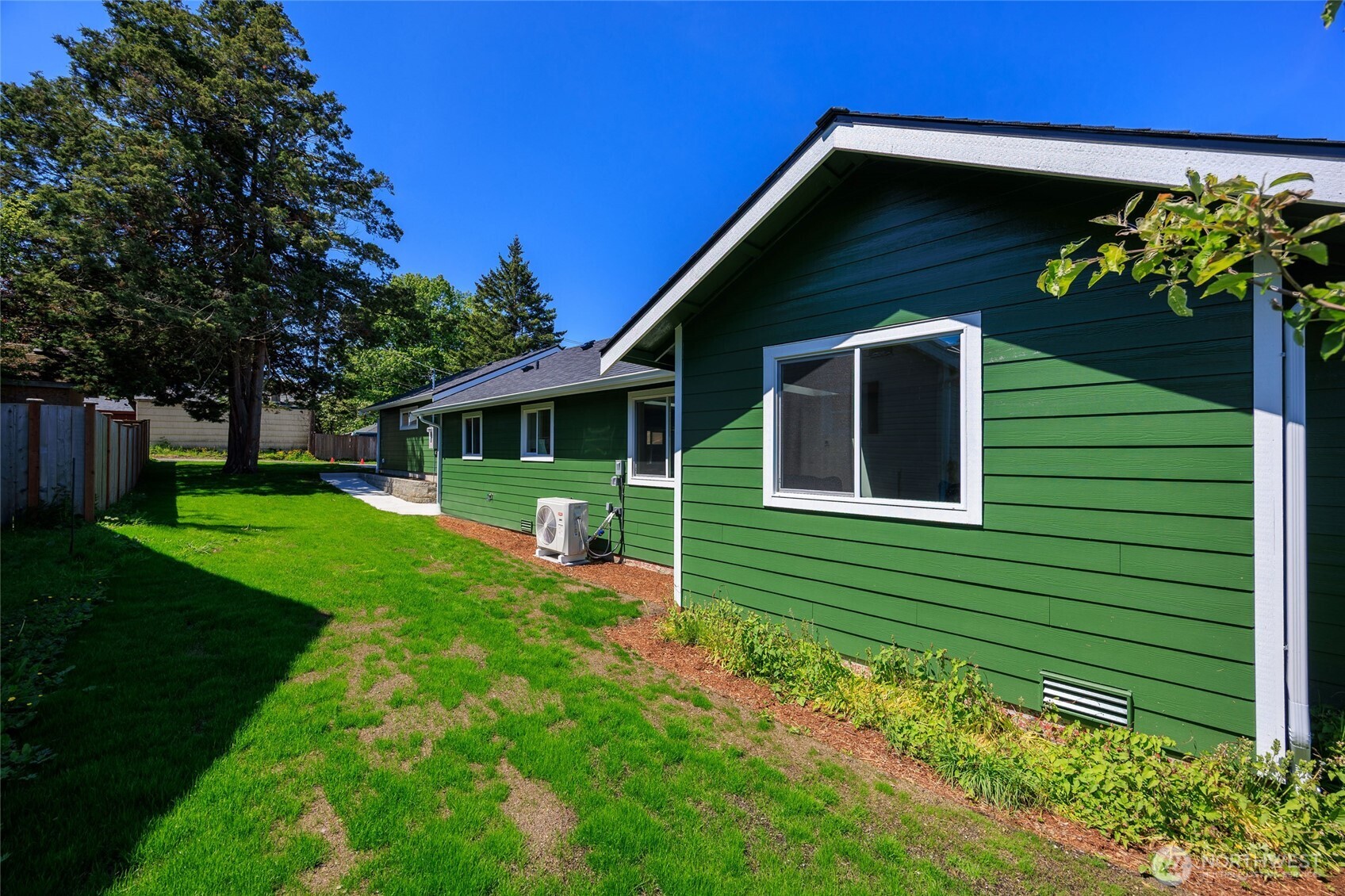 Expansive partially fenced yard.