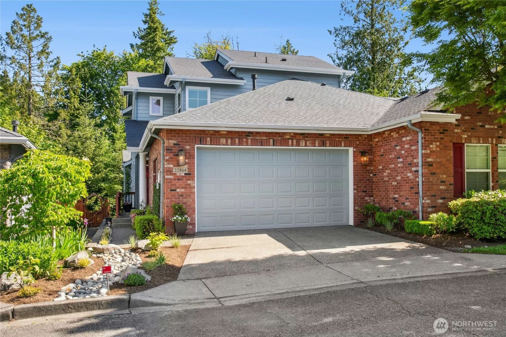 Beautiful brick accents and impeccable landscaping. Plenty of parking in front of the two car garage.