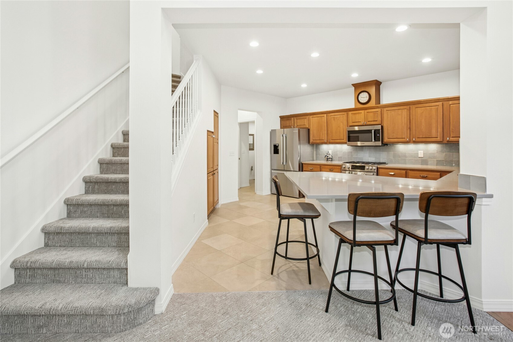 An additional view of the kitchen showcasing the quartz countertops
