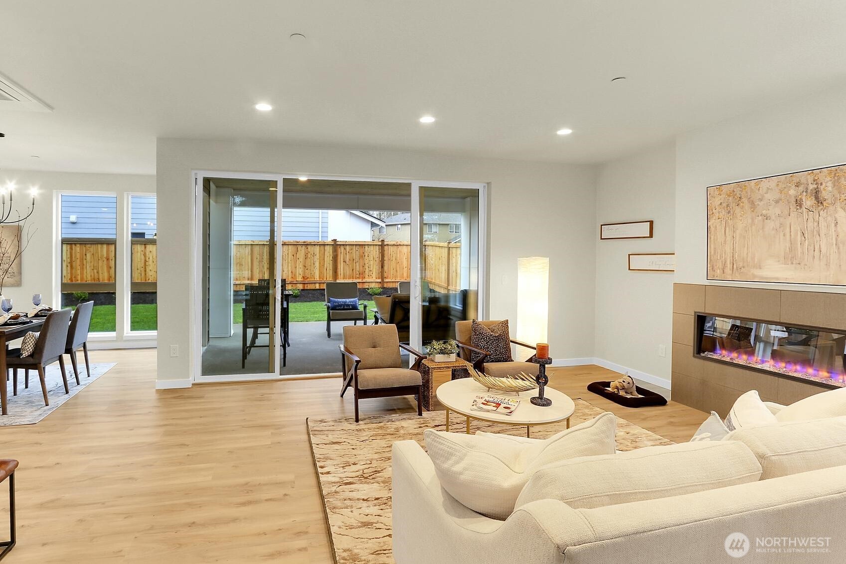 Double sliding doors from both the living and dining rooms invite you to the outdoor living room — ideal for year-round gatherings.
