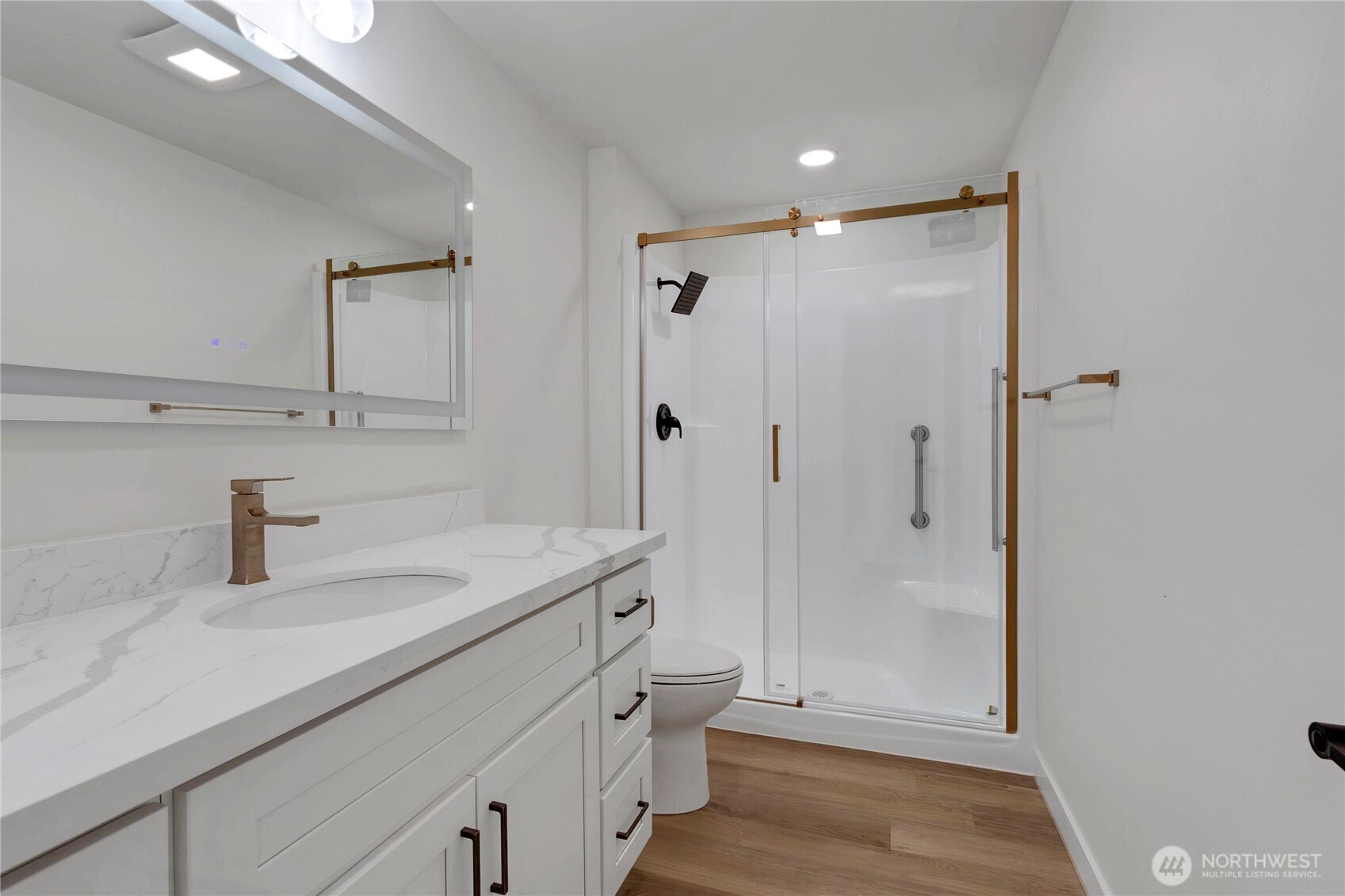 Ensuite bath with walk-in shower and lighted mirror
