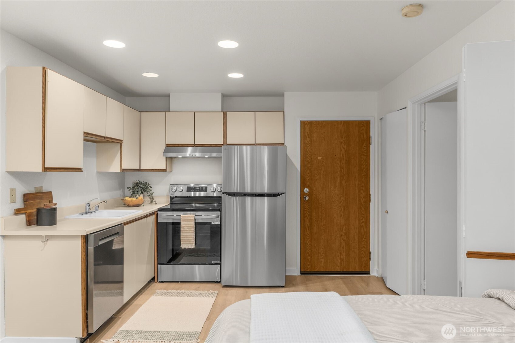 Kitchen features a brand new stainless steel LG appliances, new water heater and garbage disposal.