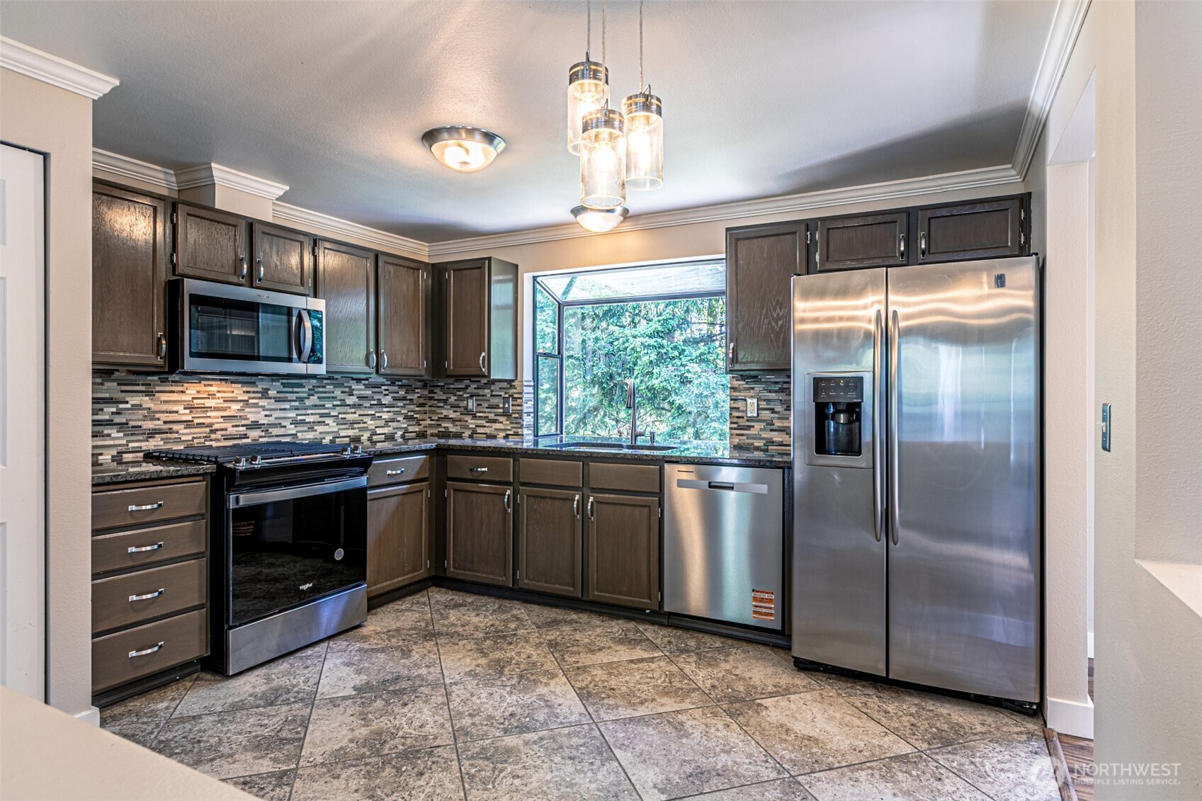 The kitchen, new dishwasher, range and microwave.