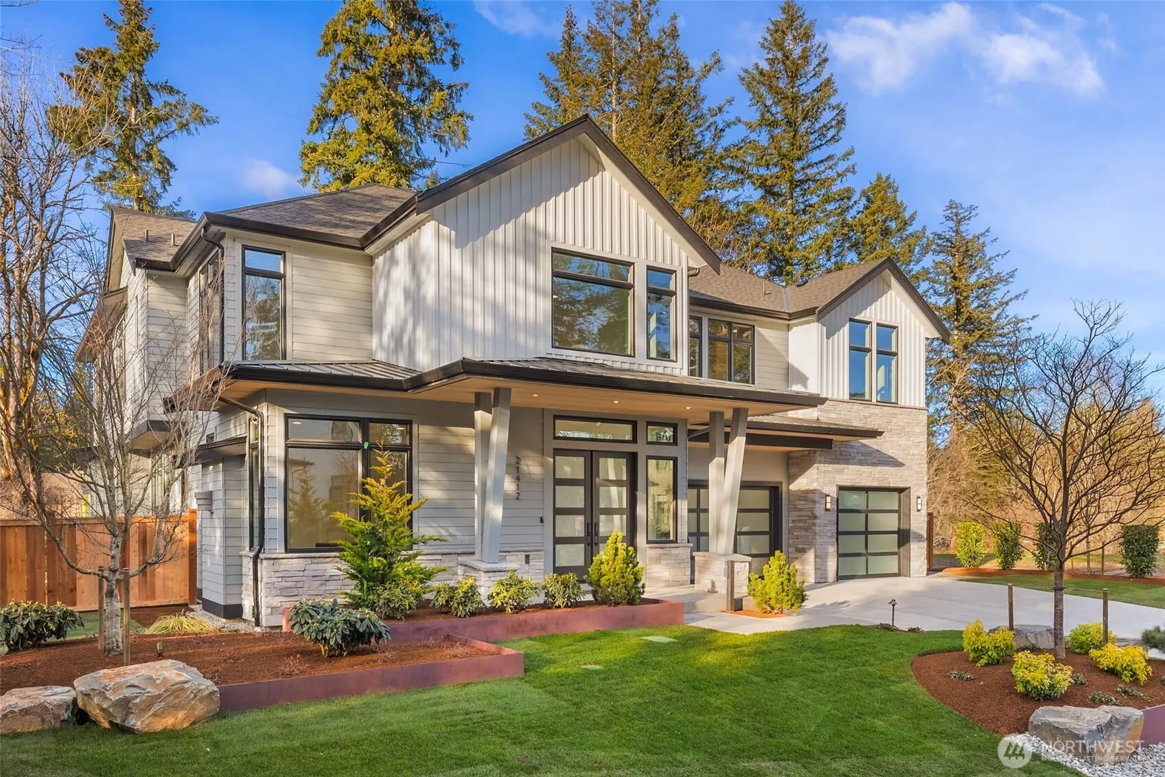 Stunning Curb appeal. Custom lansdcape design utilizes large natural stones, mature trees, custom built corten steel planting beds, and high end lanscape lighting. 3rd of this limited offering of 4 custom residences by one of the regions most respected names
