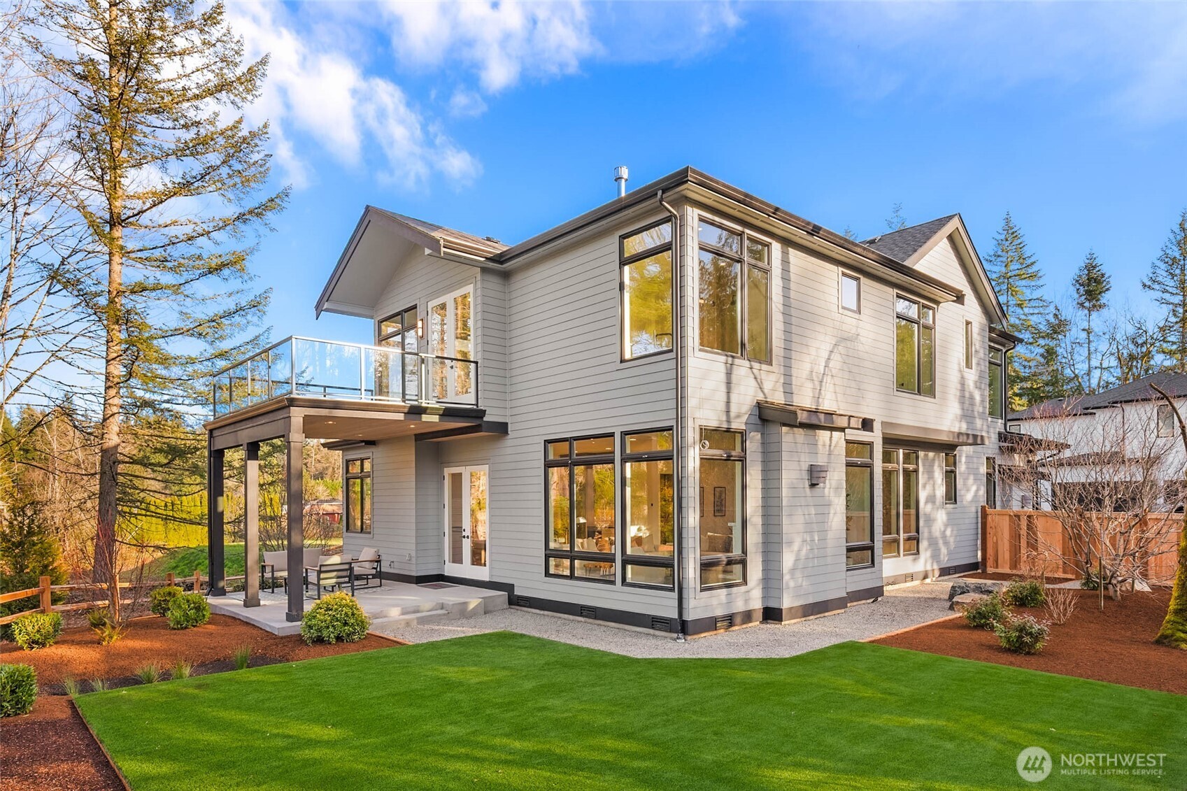 Large covered patio off great room and deck off primary