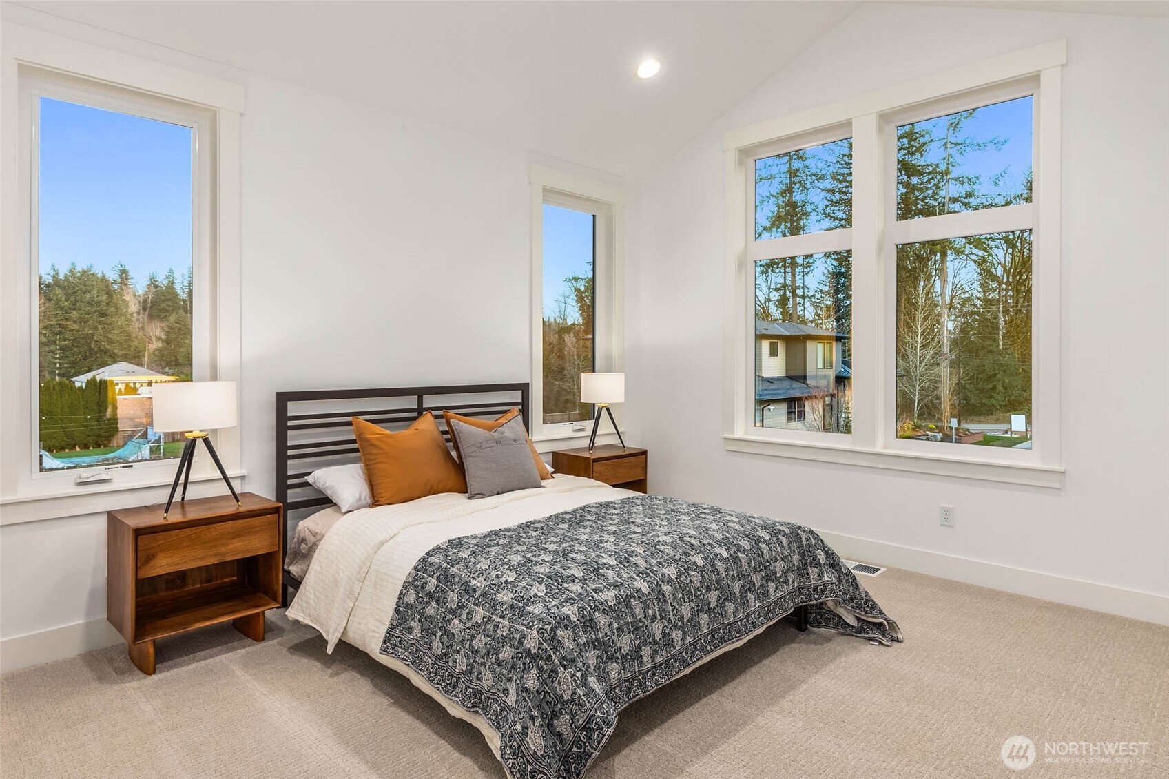 One of 5 upper floor bedrooms including primary. All bedrooms feature walk in closets with custom built solid shelving