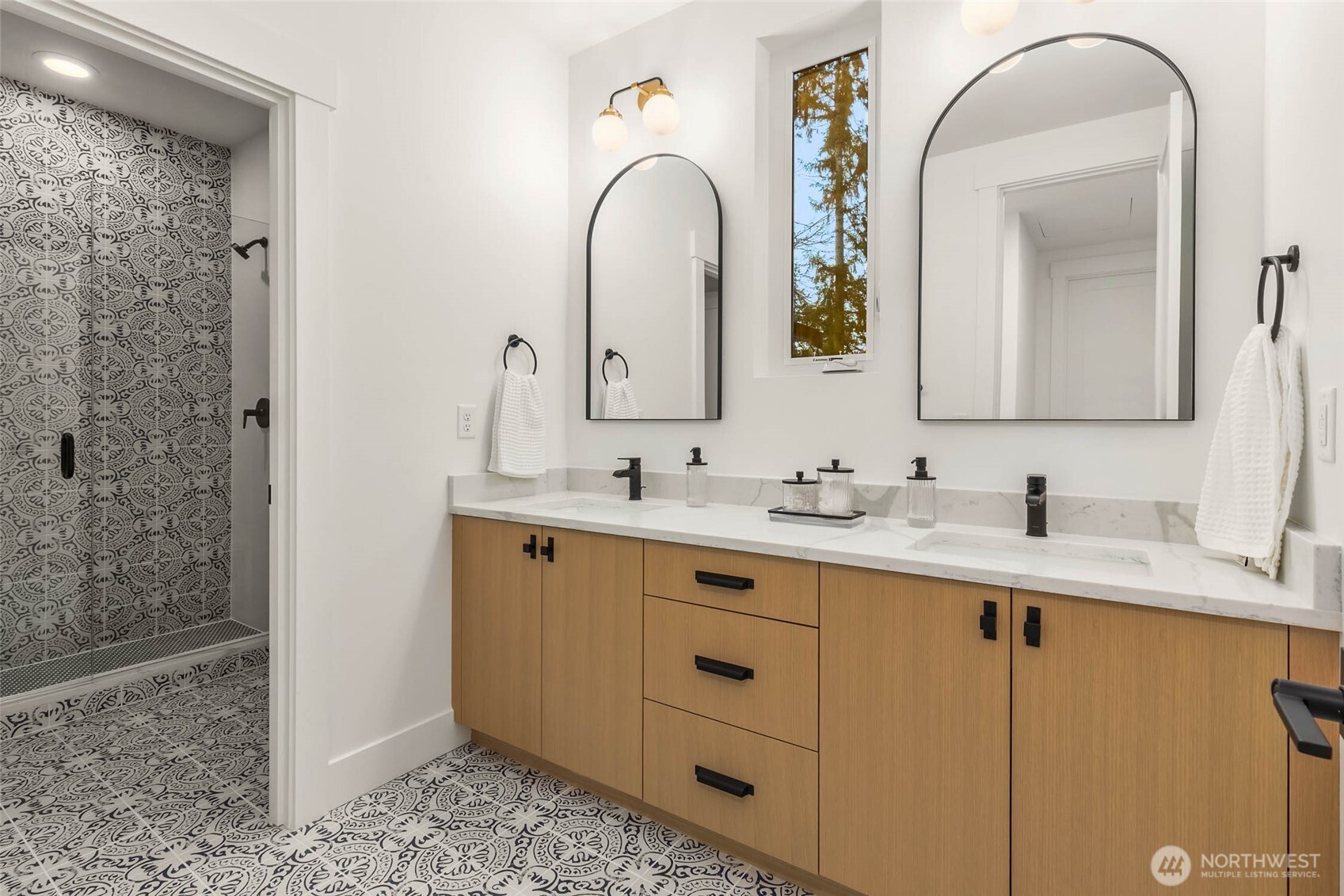 One of 3 Second Floor baths. Custom cabinets with designer slab counters, double sinks, designer tile details and frameless glass shower enclosure