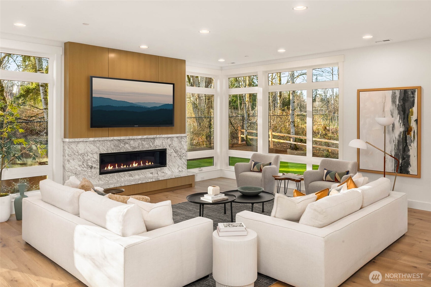 Great Room Flooded with natural light through walls of windows and 10 foot ceilings