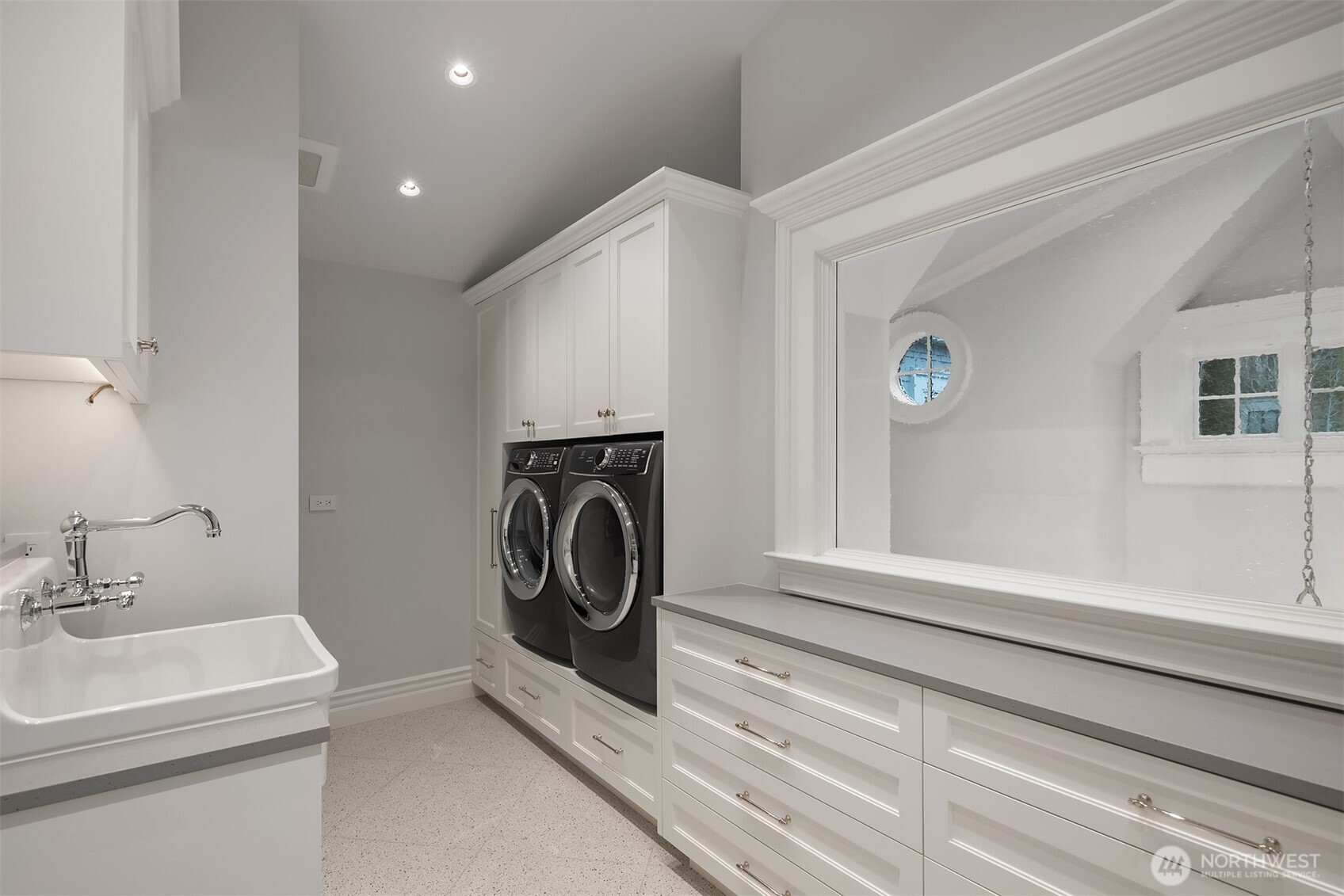How very clever they were to put a window in this laundry room overlooking the entry. It lets in tons of light and is a surprising and pretty outlook.