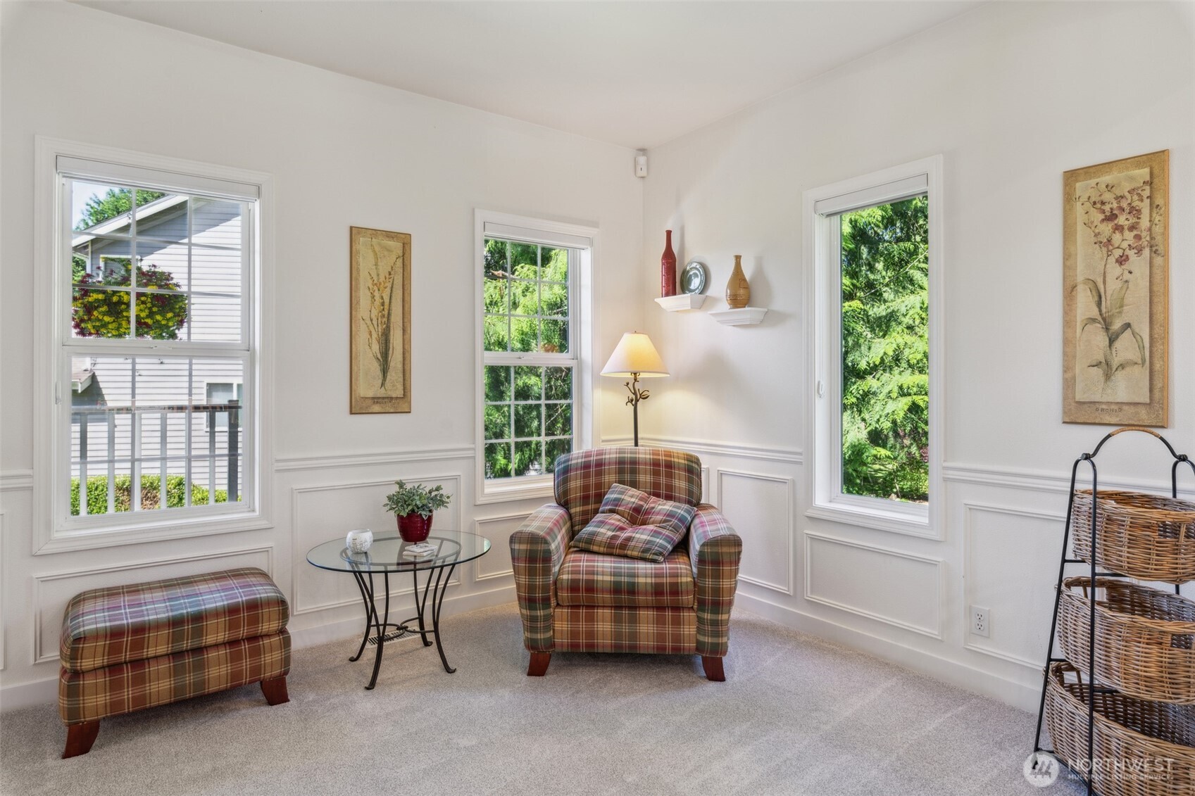 First of two living spaces on the main floor. This smaller living area is ideal for a quiet moment to read....or, with the addition of a wall and French doors, it could be a main floor office.
