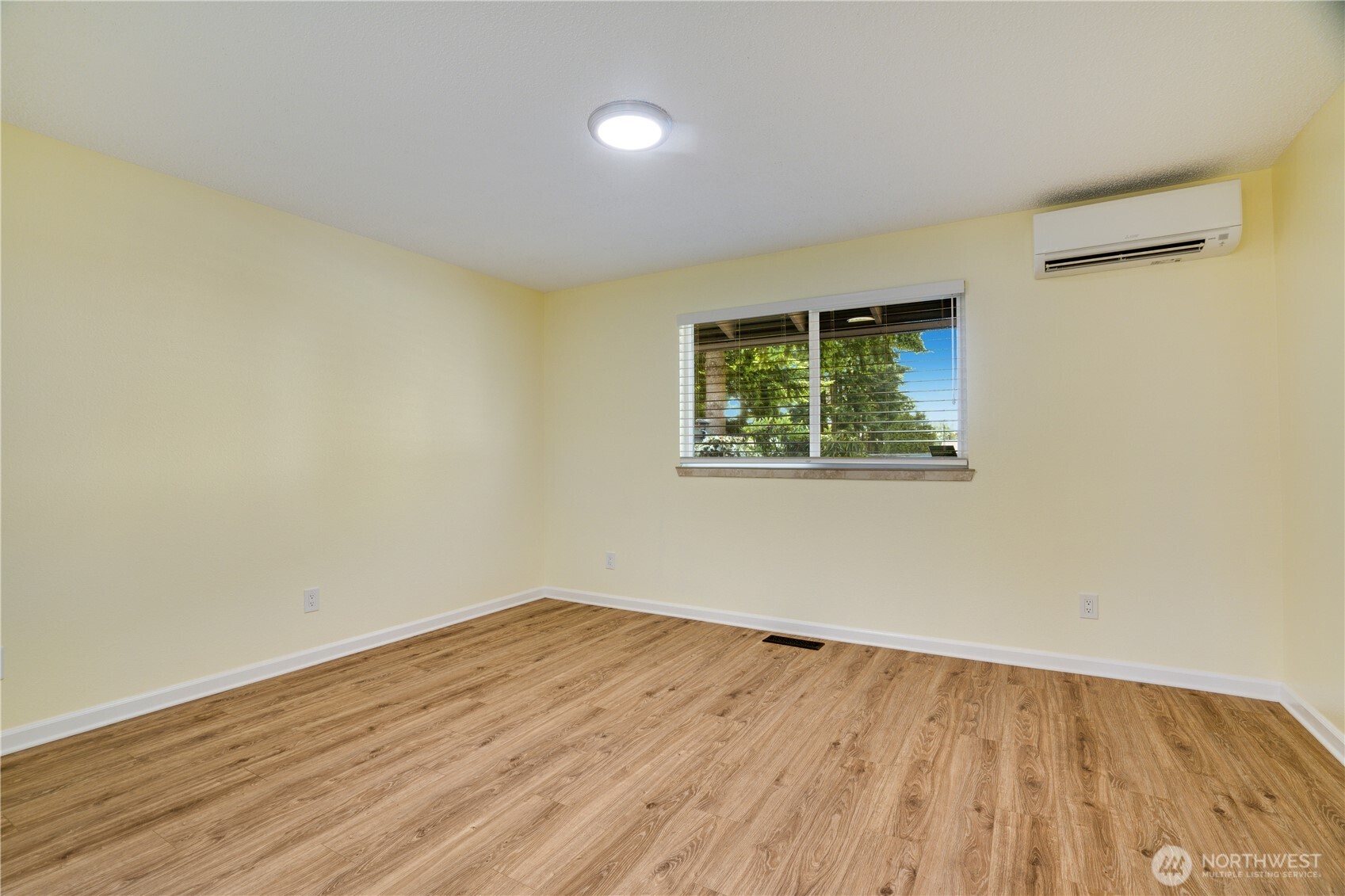 Primary Bedroom backs to green space.