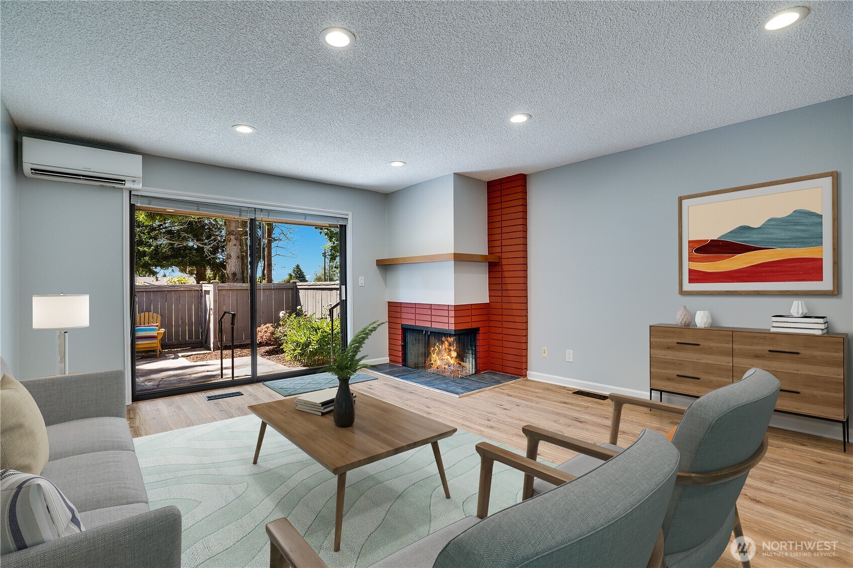 View of corner fireplace and dining area. This is Virtually Staged.