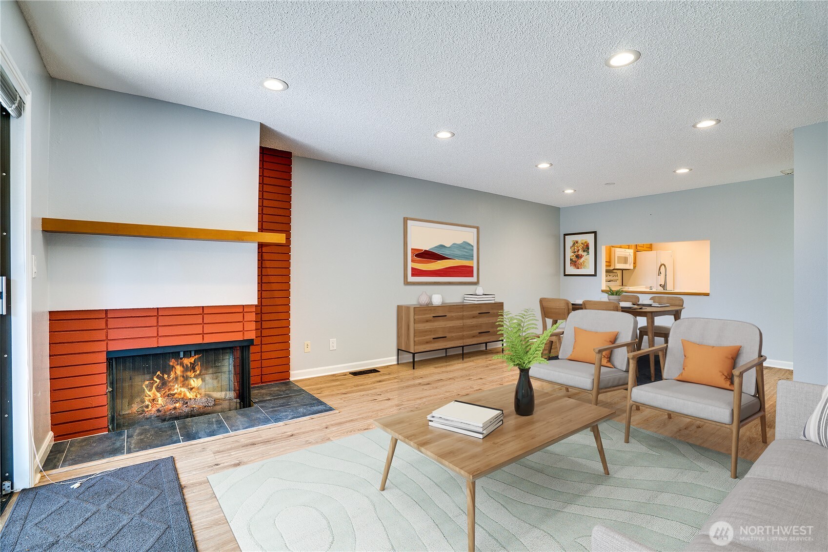 View of dining and living room area showing Virtual Staging.
